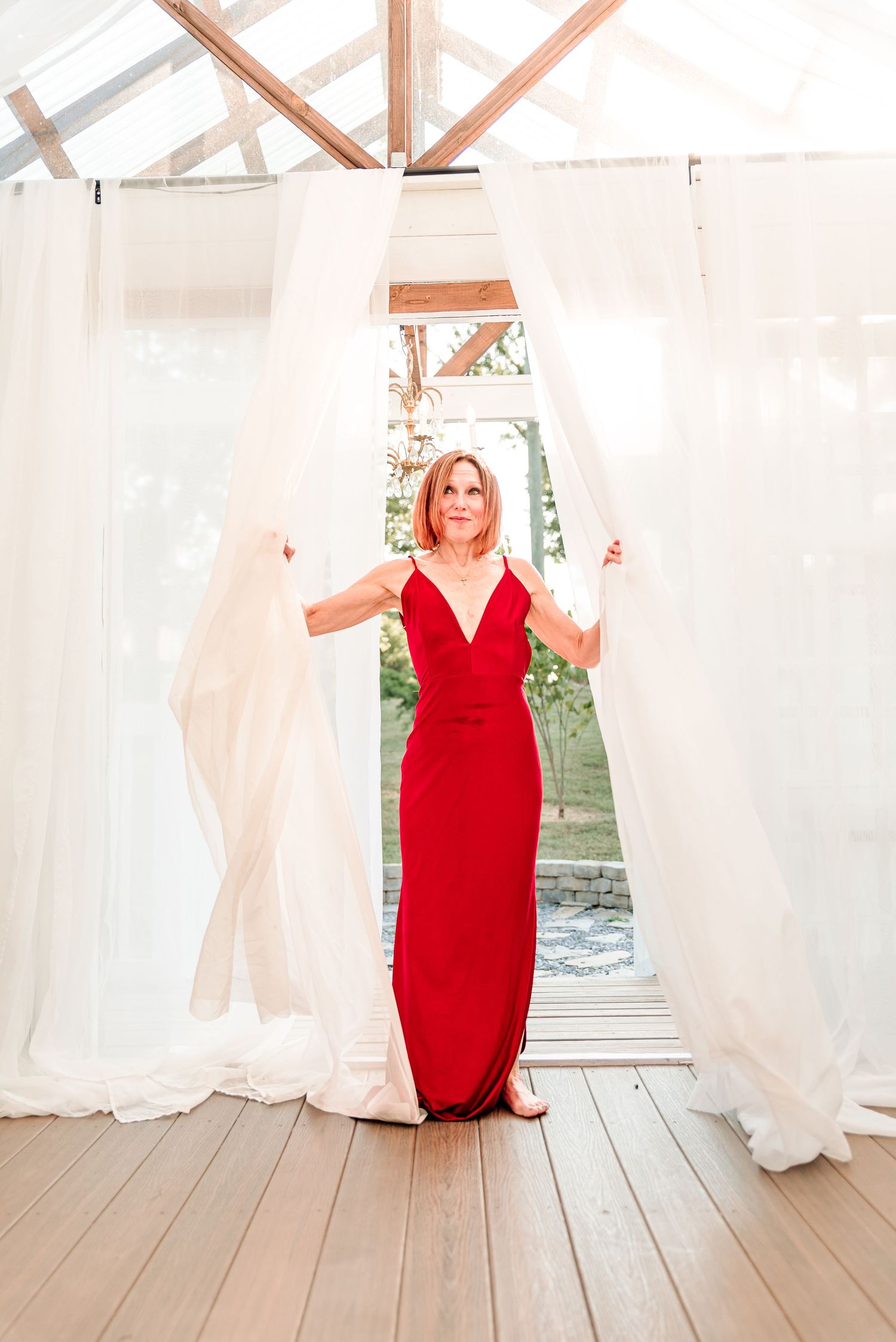 Woman in red dress standing in the doorway of The Greenhouse, Kingsport