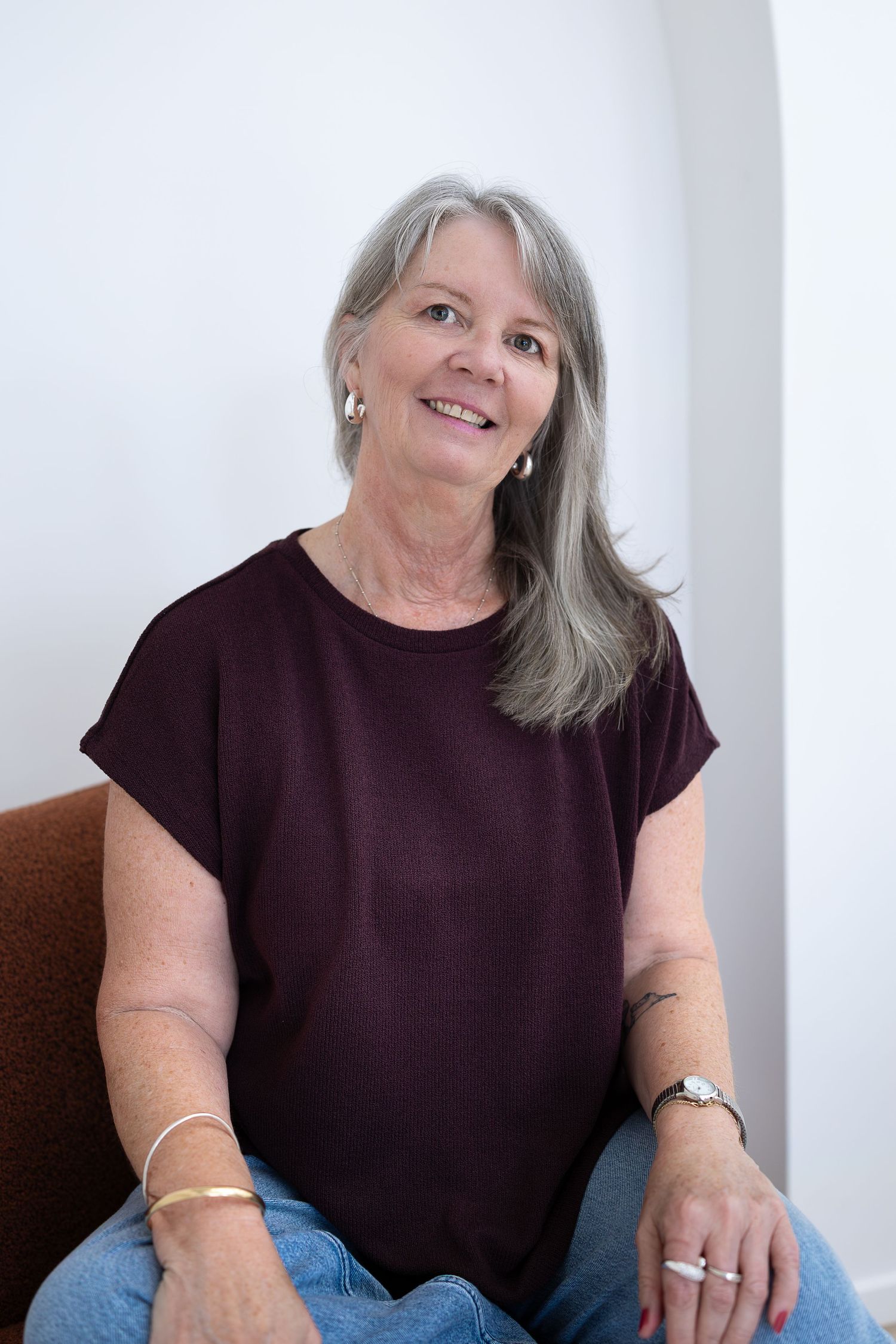 A person holding a camera in bright light