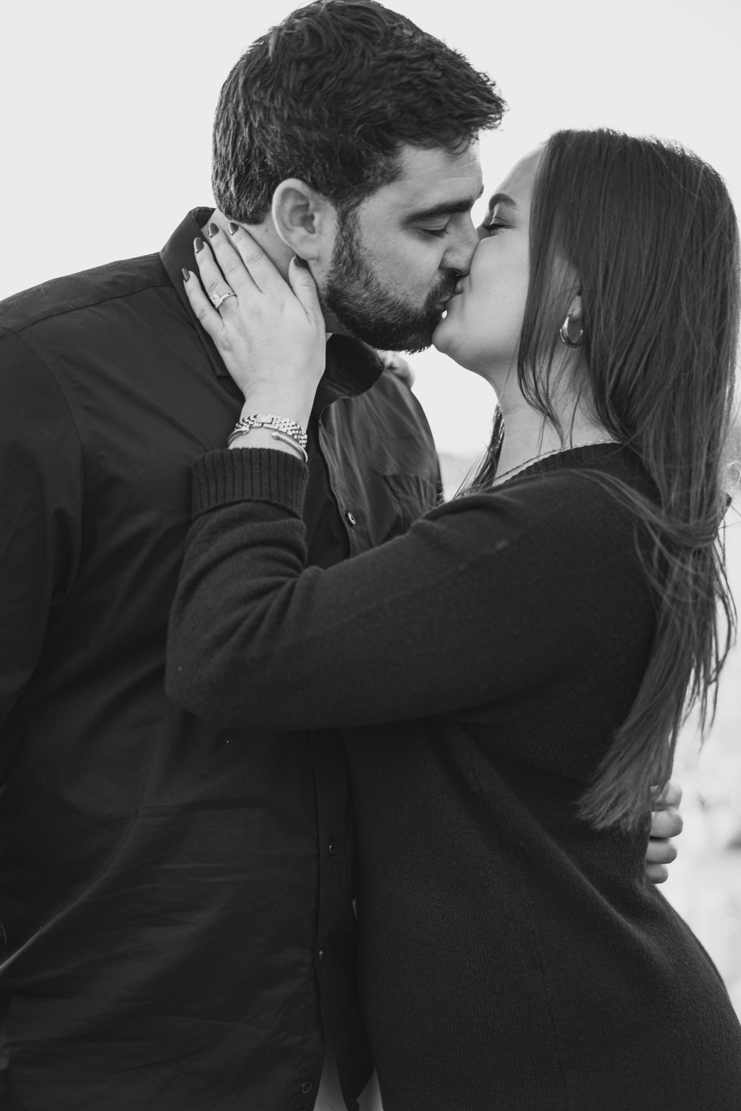 Black and white portrait series capturing intimate romantic moments between a couple.