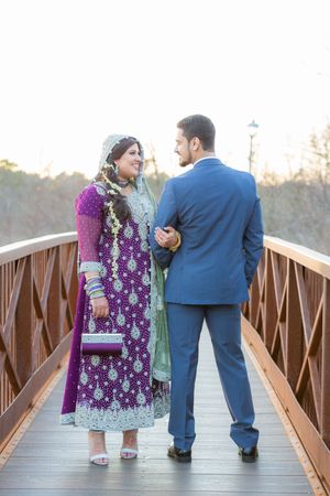 Three sequential shots of a couple in formal attire sharing a romantic moment on a wooden bridge at sunset.