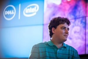 Professional presentation featuring Dell and Intel logos with blue lighting and purple backdrop.