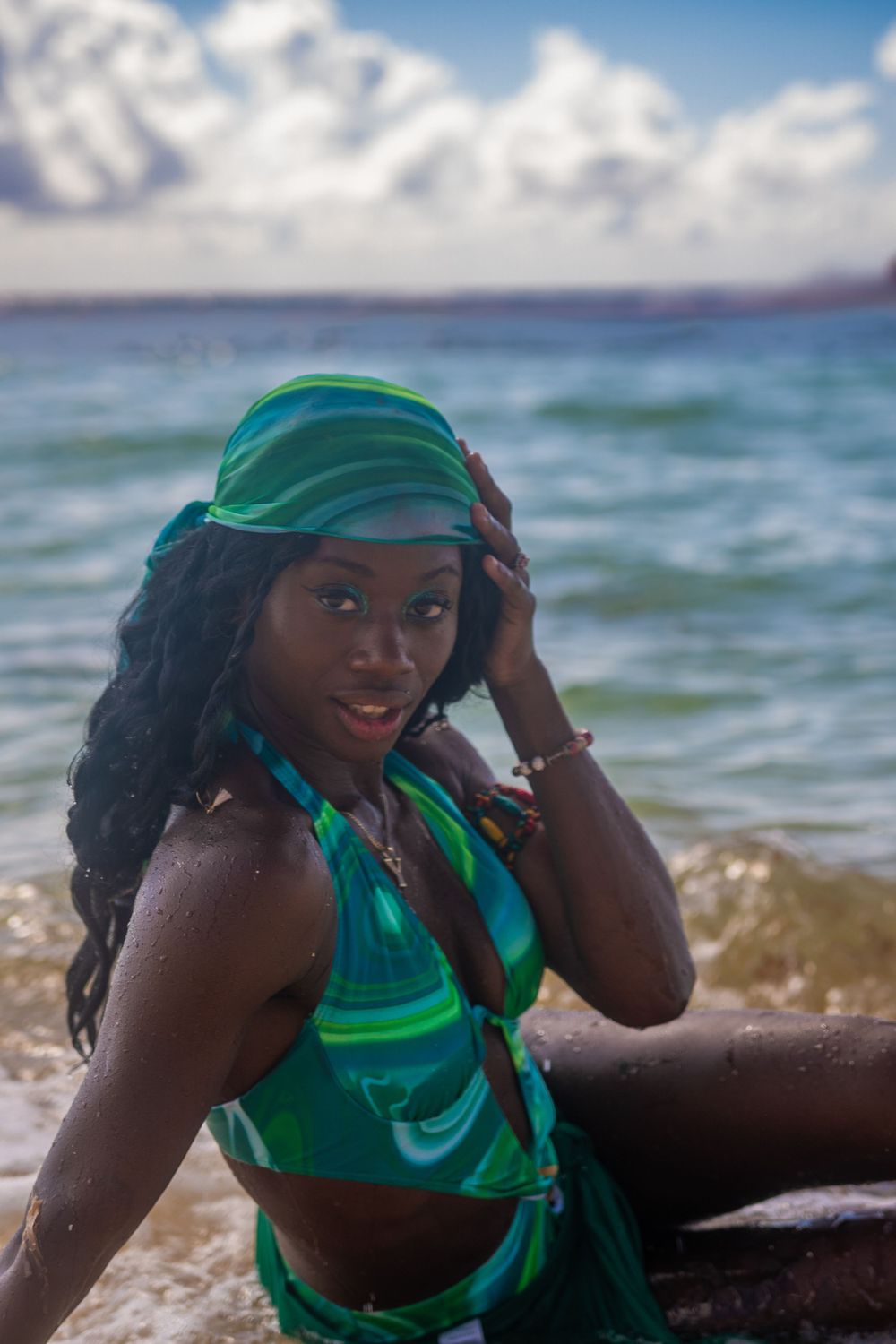 Candid lifestyle photo of a woman walking barefoot on the beach