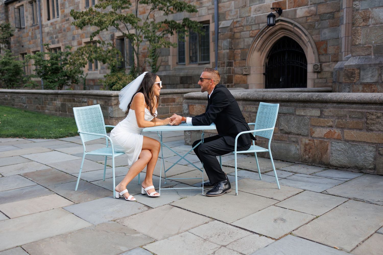 Engagement session on Yale University campus. A photo of a seated couple.