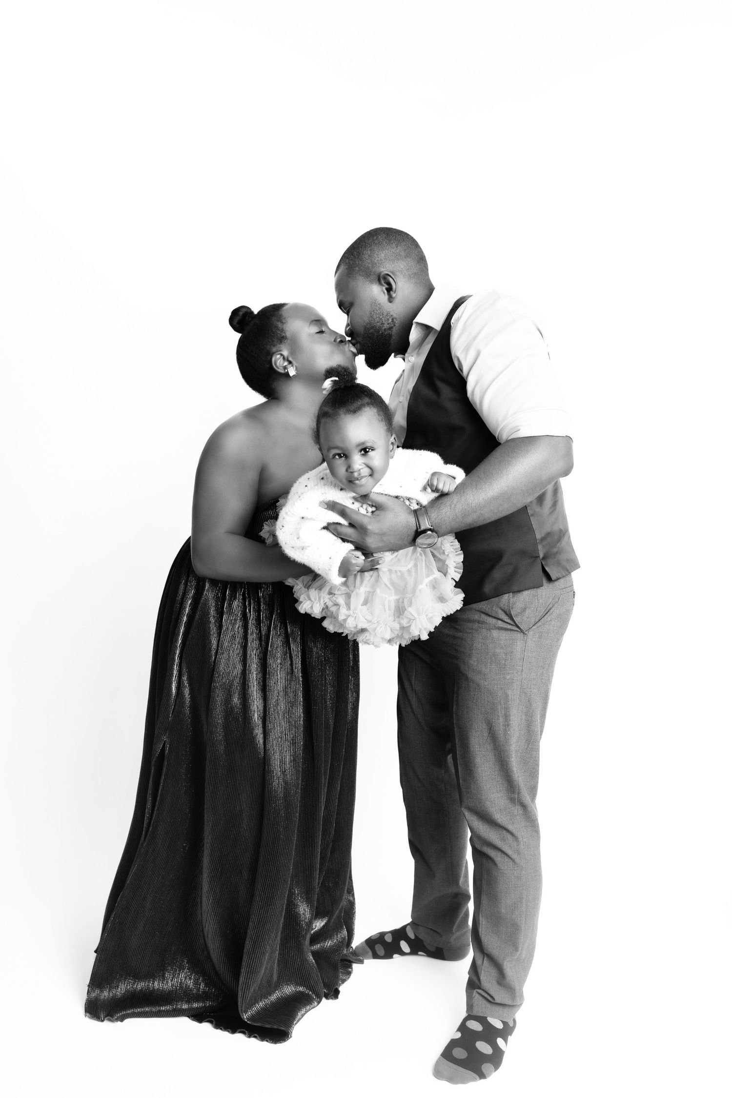 A tender black and white family portrait capturing an intimate moment.