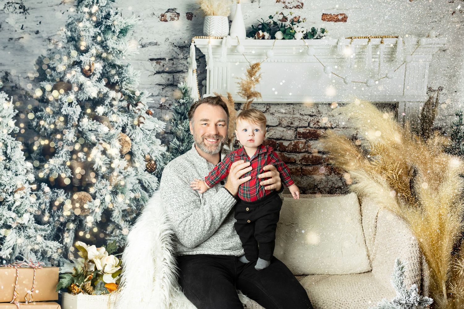 Festive Christmas scene with decorated tree and cozy seating area in front of white brick fireplace.
