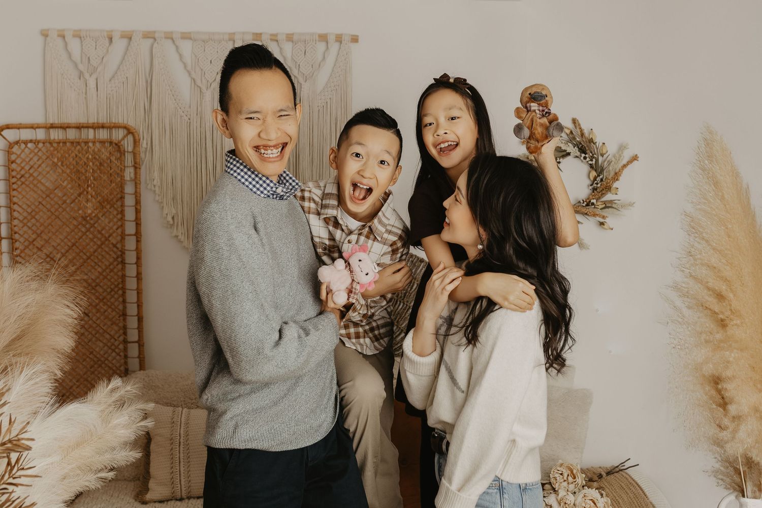Lifestyle family session featuring casual poses and natural interactions in a bright setting.