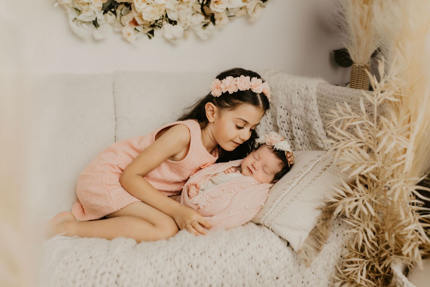 Dreamy lifestyle photography session with soft lighting and neutral decor.