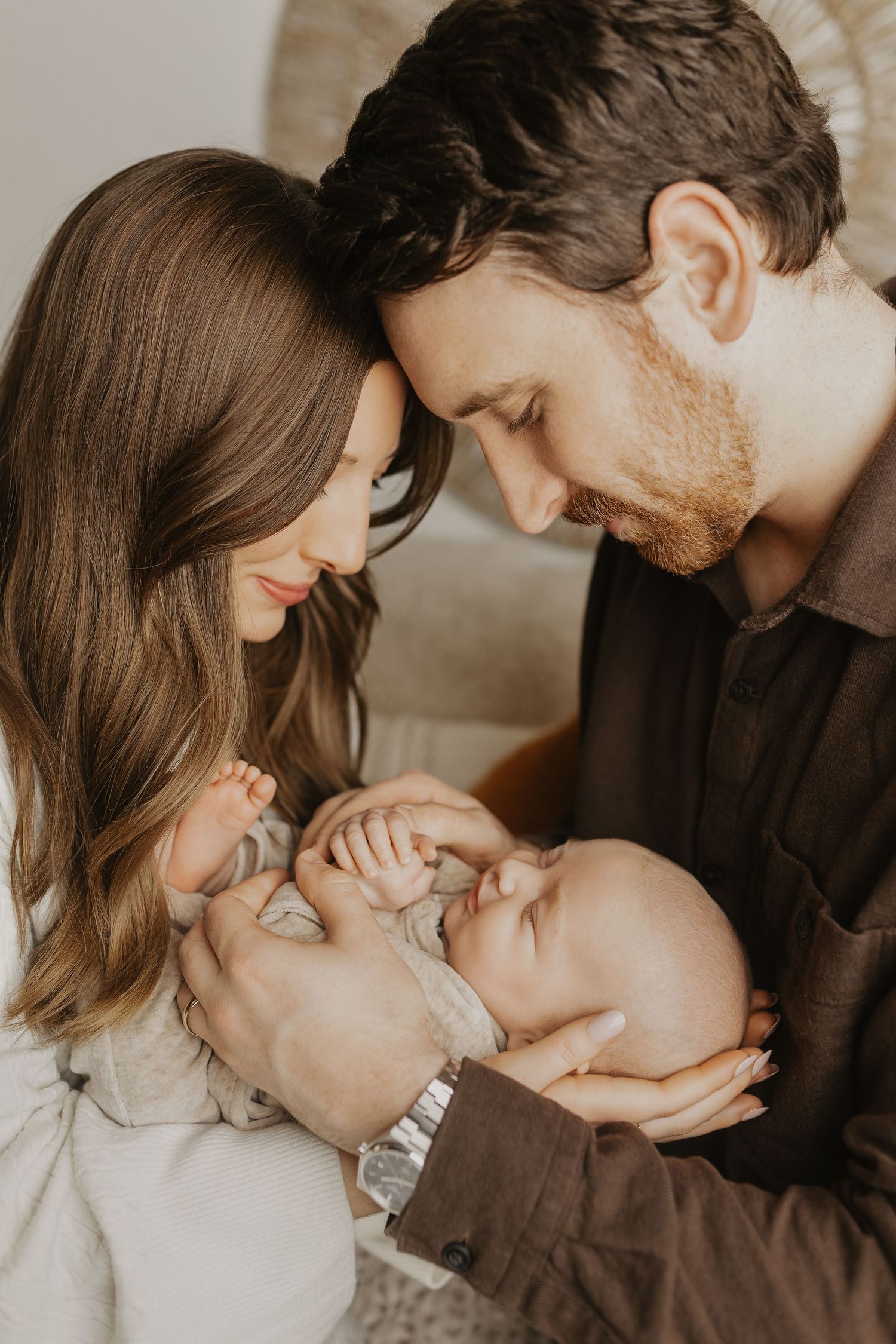 Tender family moment captured in warm tones with natural lighting.