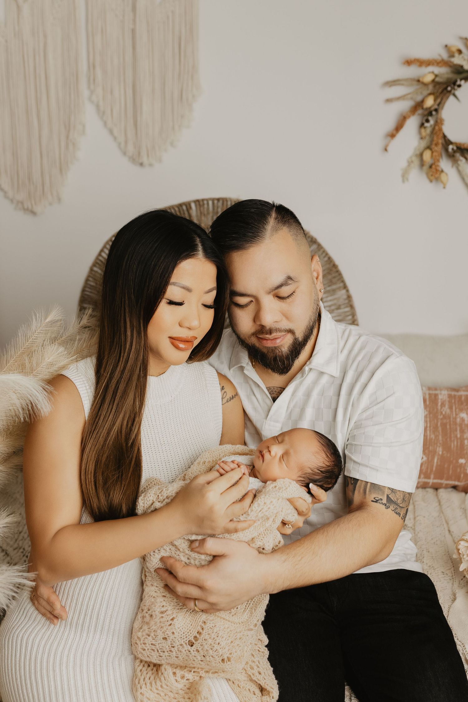 An intimate family moment captured in a warm, neutral-toned setting.