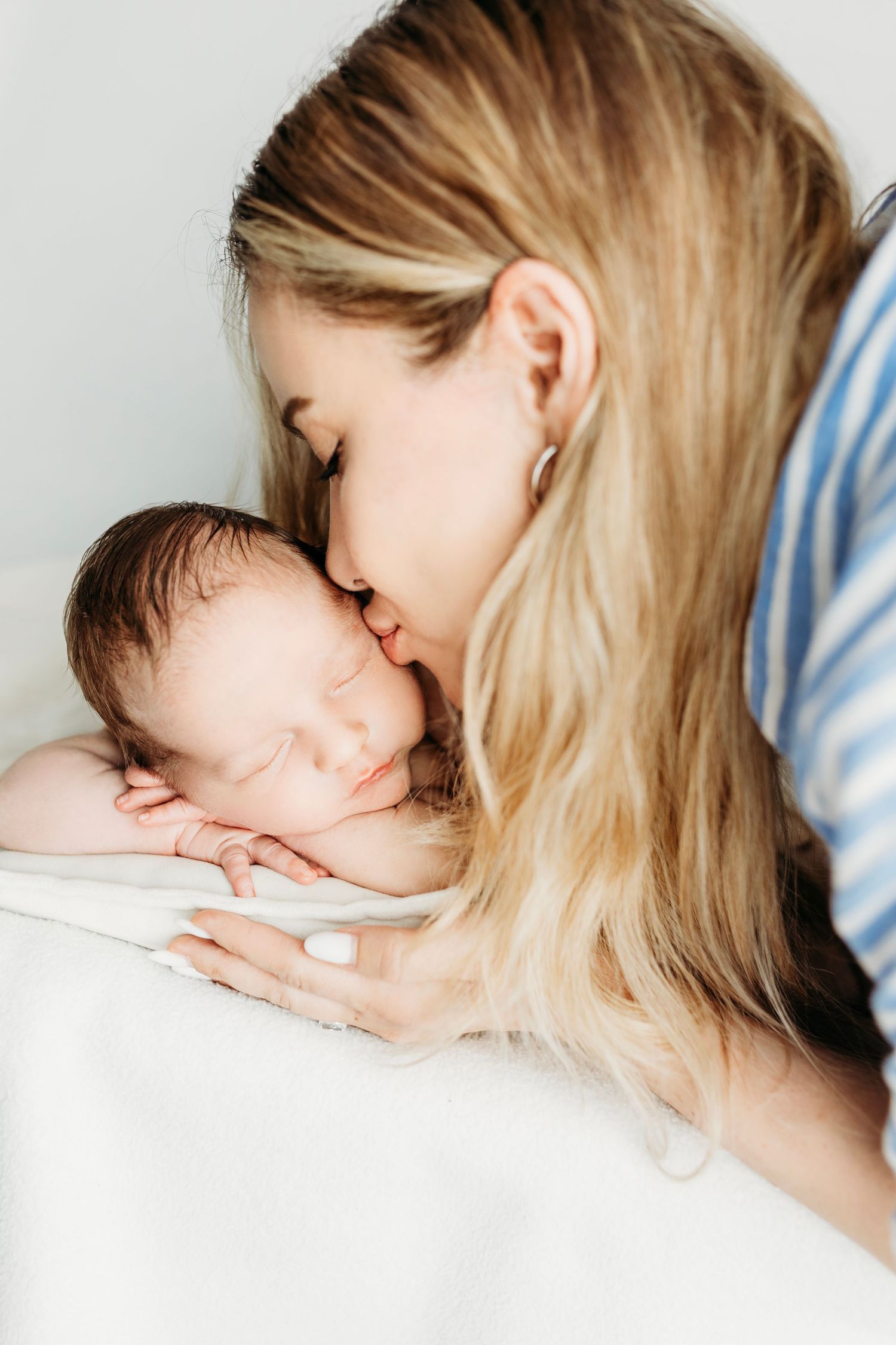 Soft and dreamy newborn photography session with gentle natural lighting.
