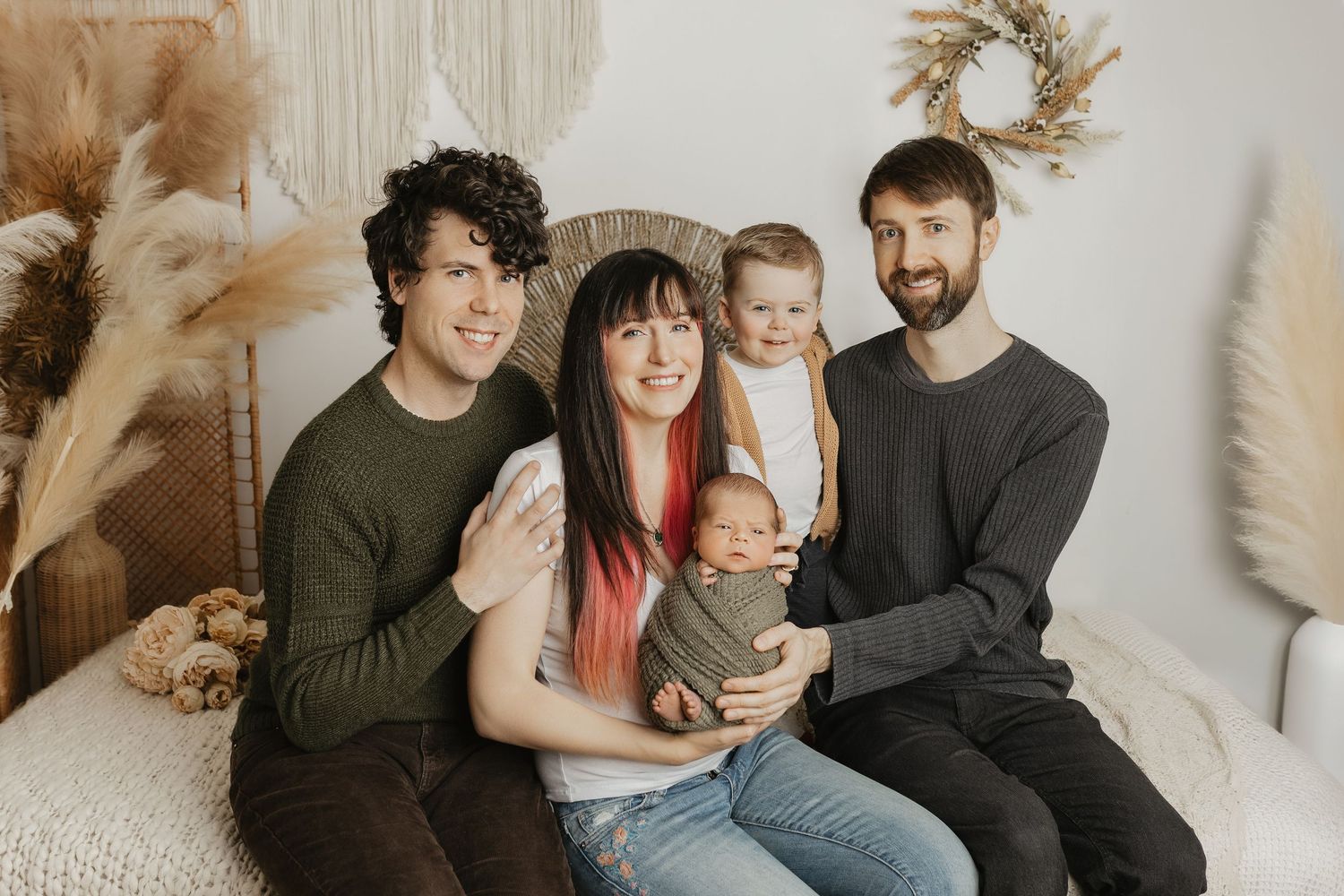 Lifestyle family photography session showing loving moments on a cozy couch with decorative elements.