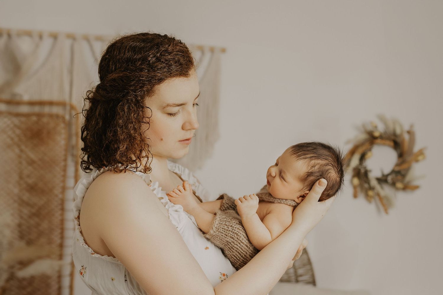 Gentle lifestyle photography sequence showing tender moments between parents and baby.