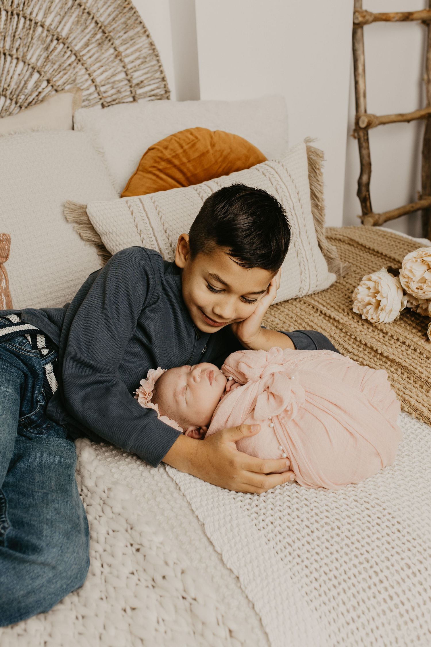Tender sibling moment captured during indoor lifestyle photography session.