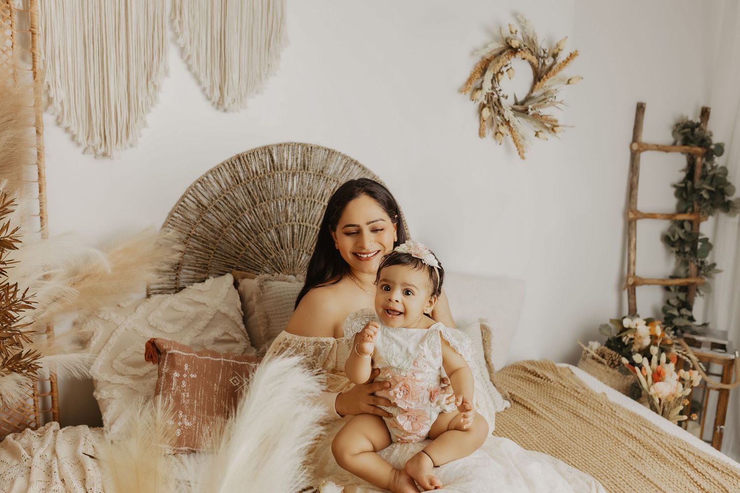 A series of intimate family photos showing tender moments between parent and child in white and beige tones.