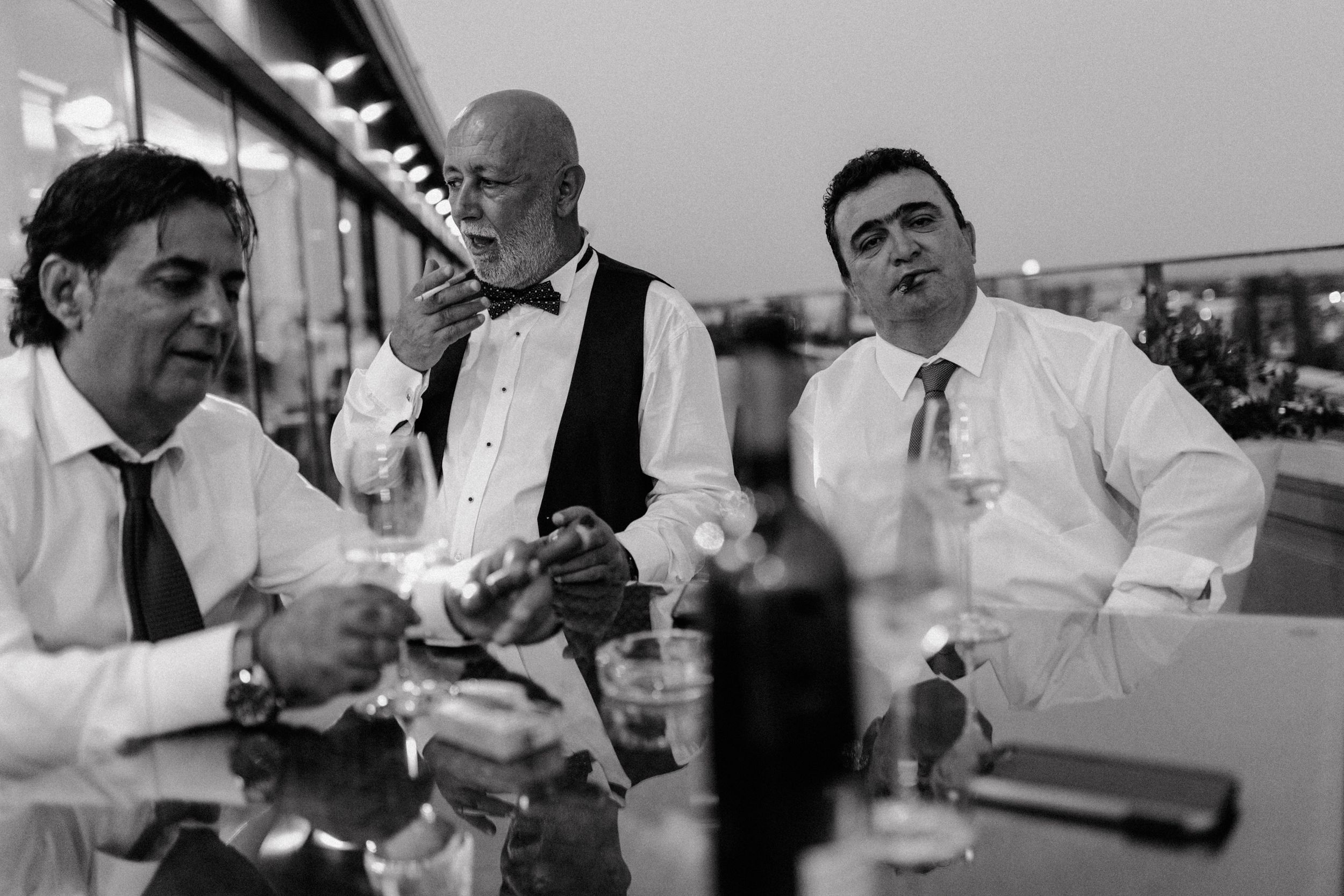 Group of friends and family at a wedding reception, drinking wine and socializing on the terrace of Bon Apetit, Zagreb.