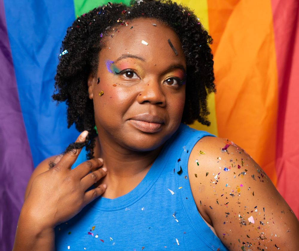 Studio portraits against a rainbow pride flag background with colorful makeup and glitter details.