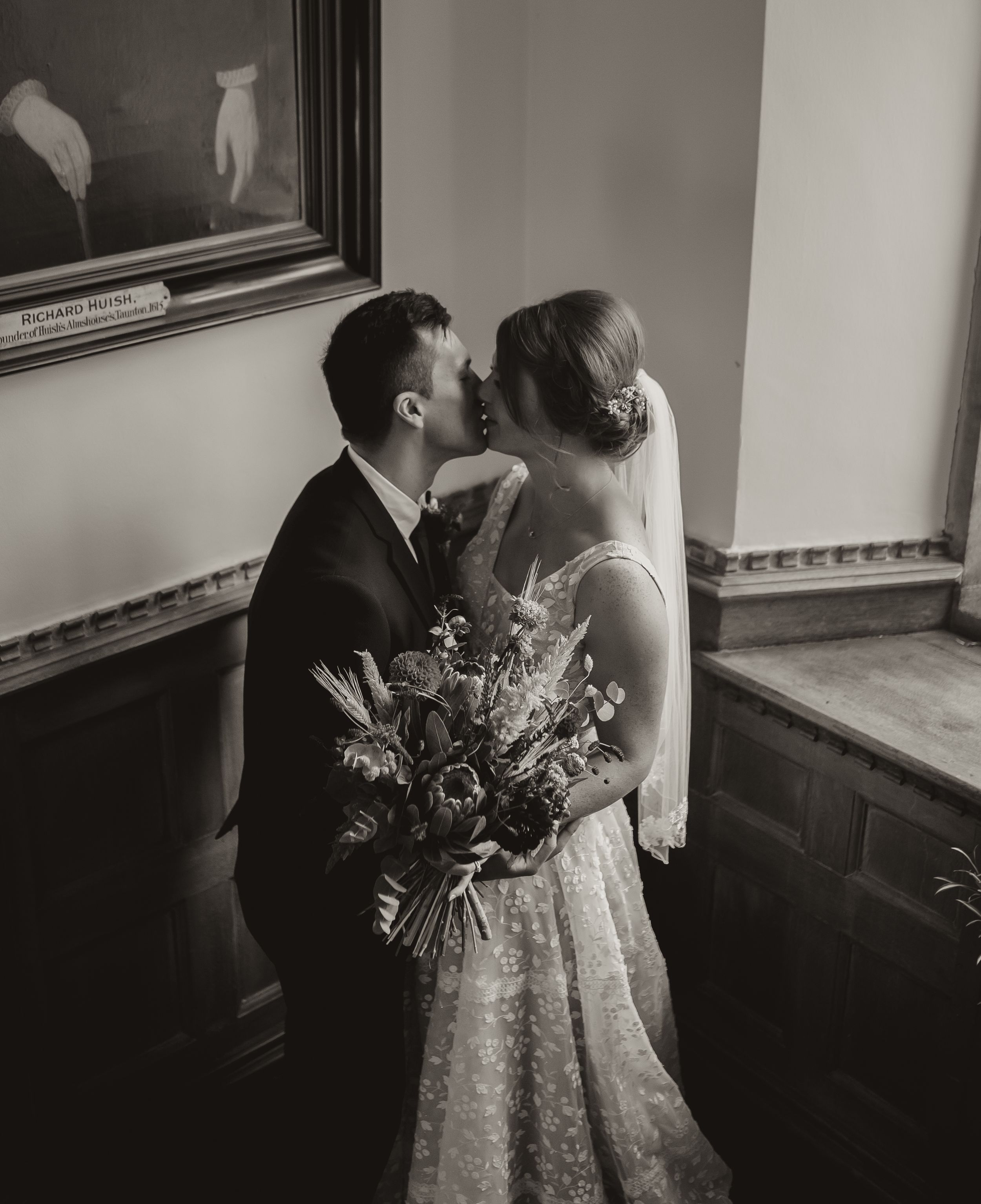 Romantic black and white portrait sequence showing couple embracing with wedding bouquet.