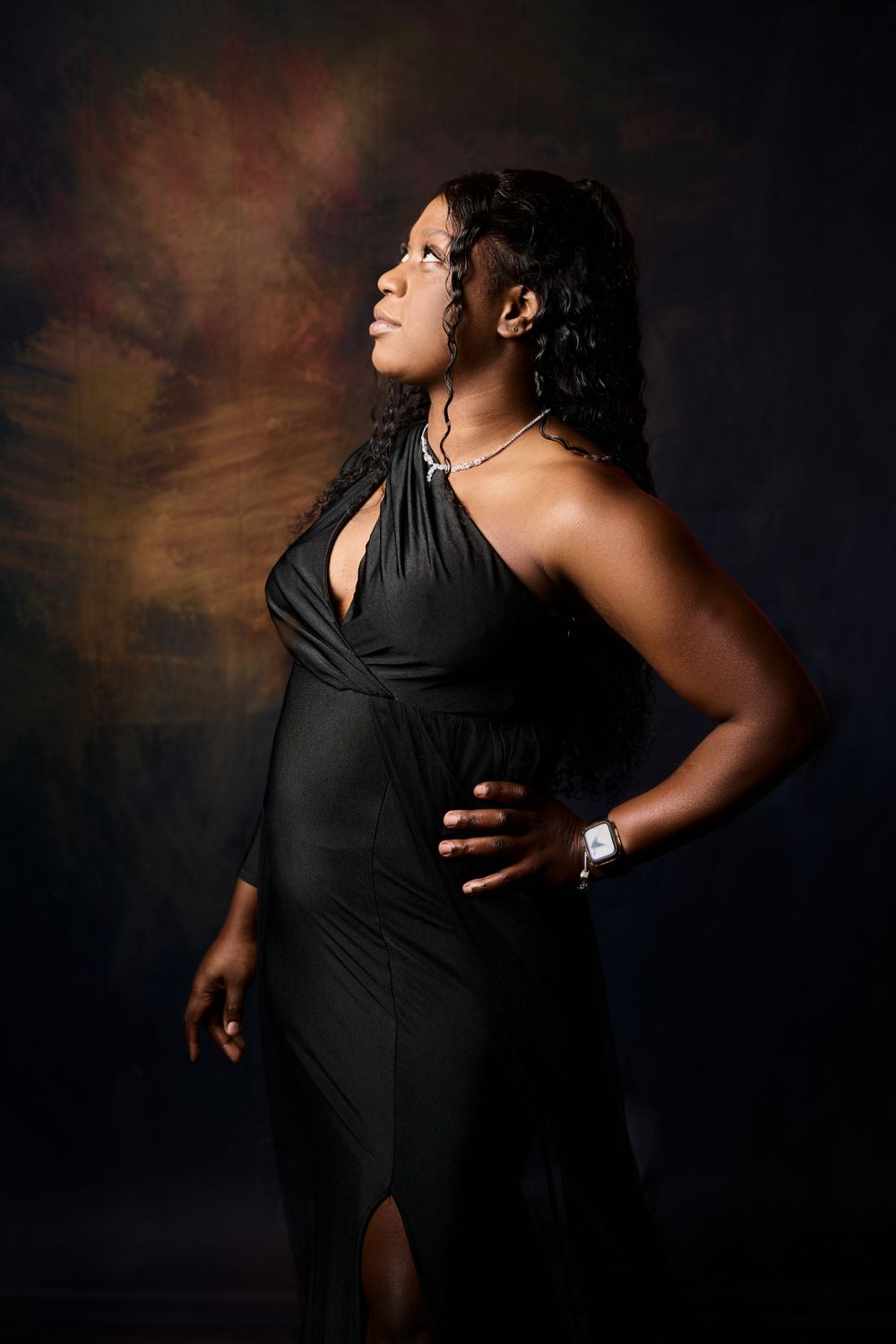 Artistic side profile shots of a pregnant woman in a black dress against a dark background.