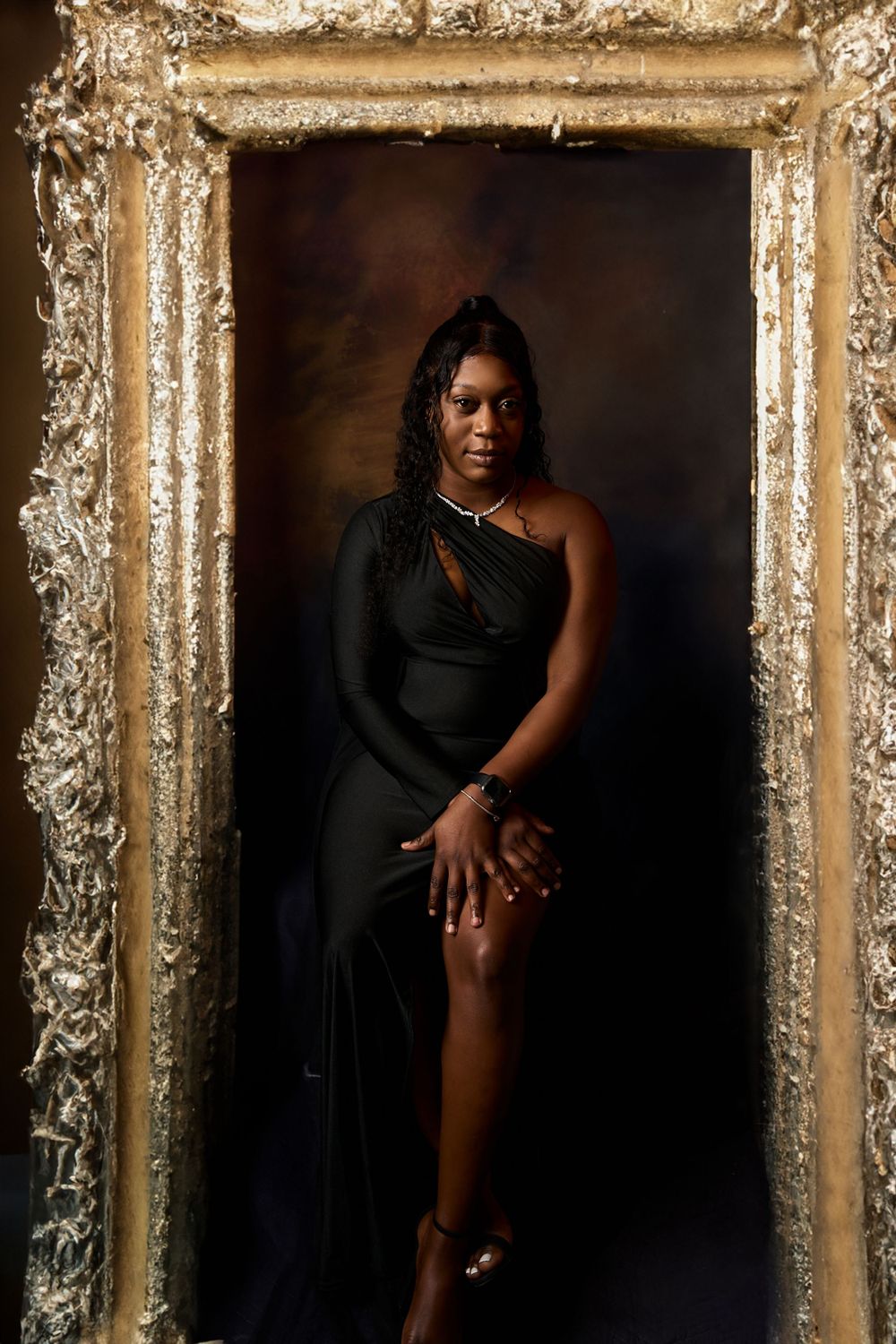 Dramatic maternity portraits taken against a textured gold backdrop with ornate framing elements.