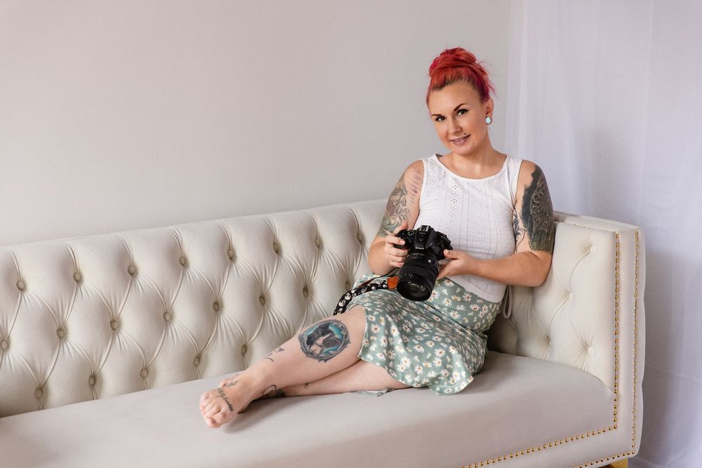 Empowered Female Photographer in Skirt with Camera | Venice FL Boudoir Studio