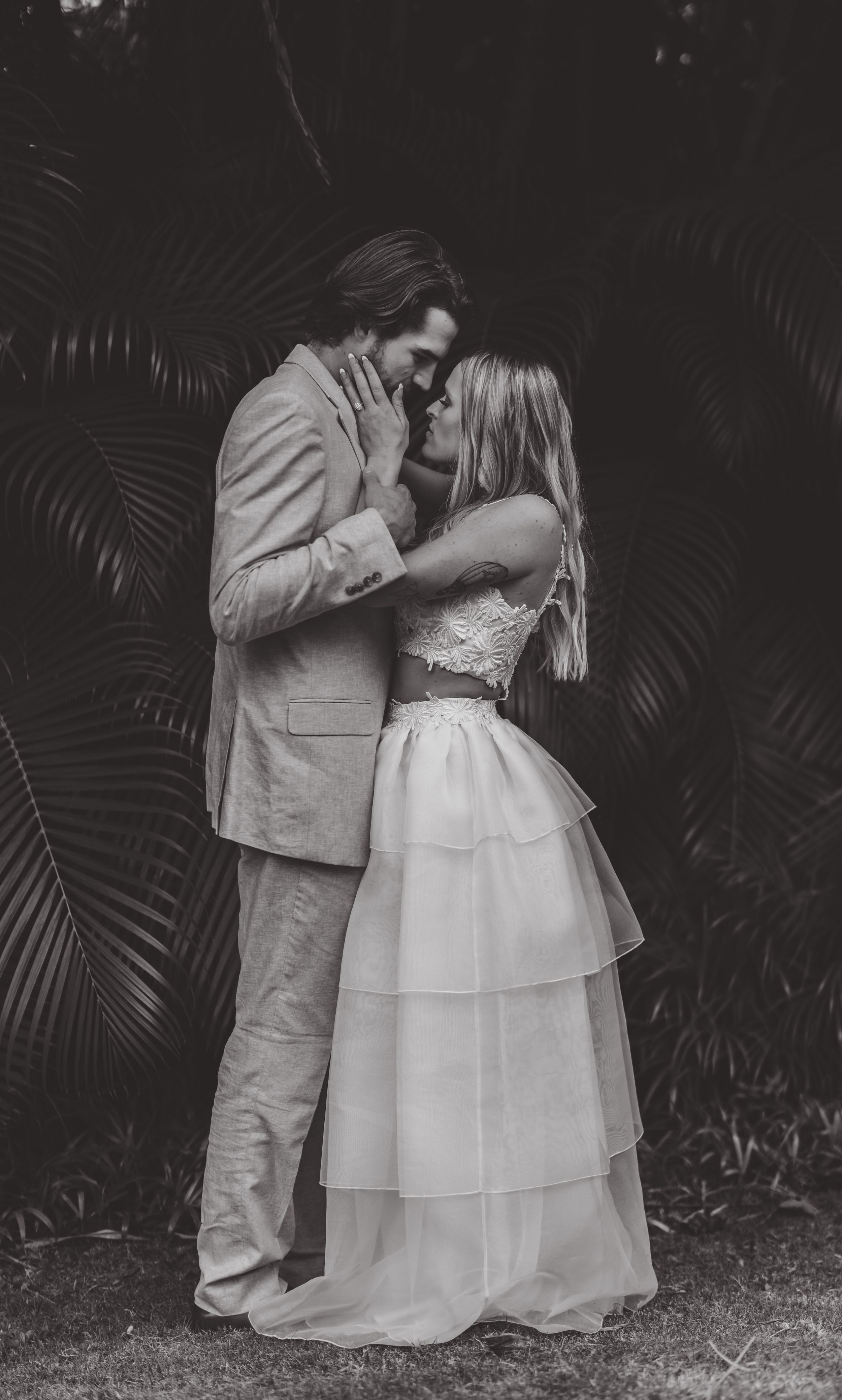 Couple embracing in black and white, photographed by David Jesse Photography