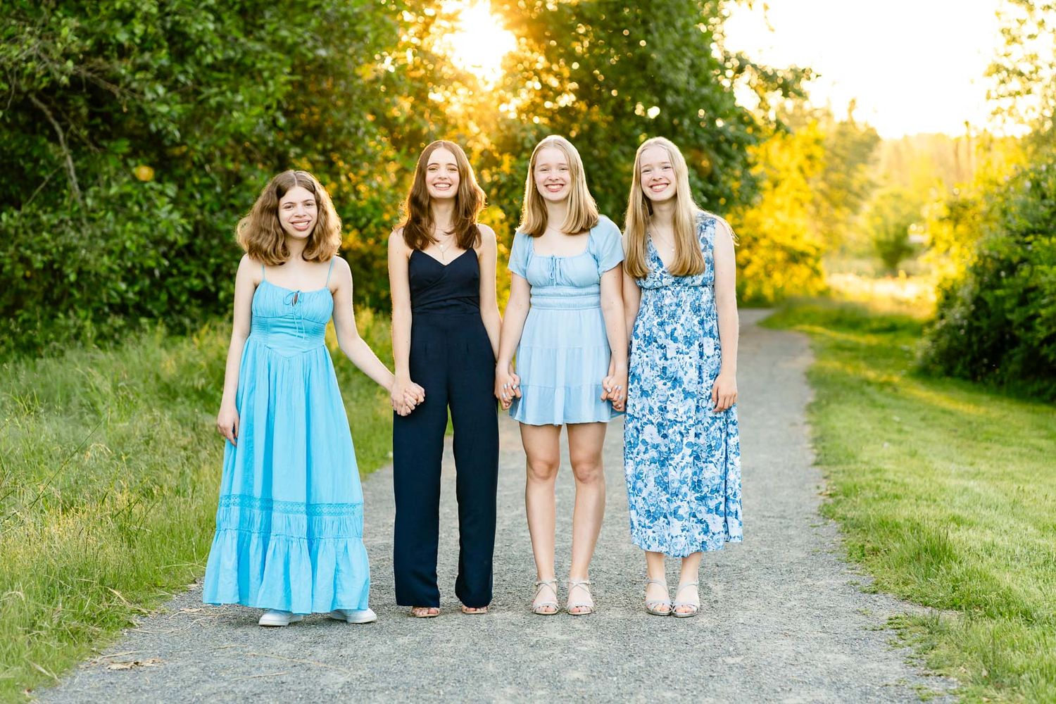 Sisters posed portrait at sunset in Seattle.