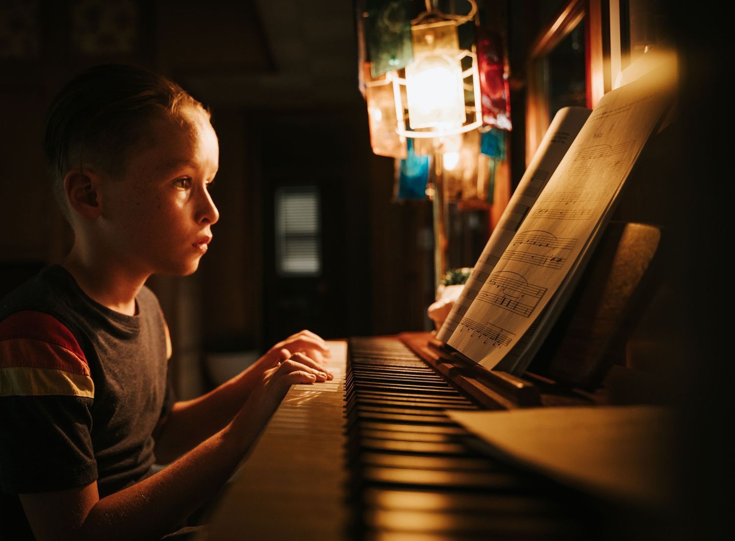 Child practicing piano for a fine art portrait by local Jacksonville, Florida photographer Oh Snap Photography