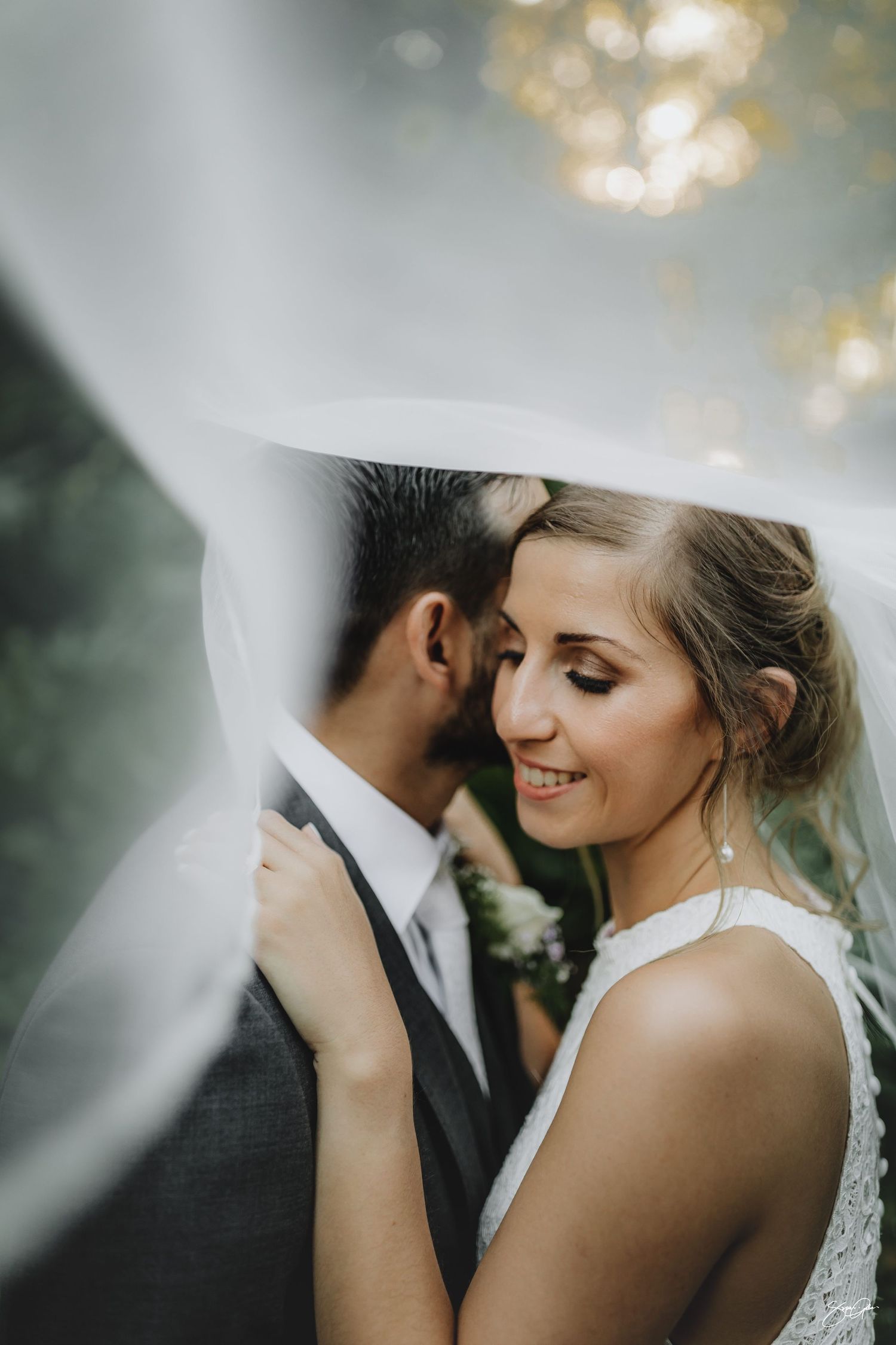 Wedding couple under the veil during their hamilton wedding in Gails of Tamahere