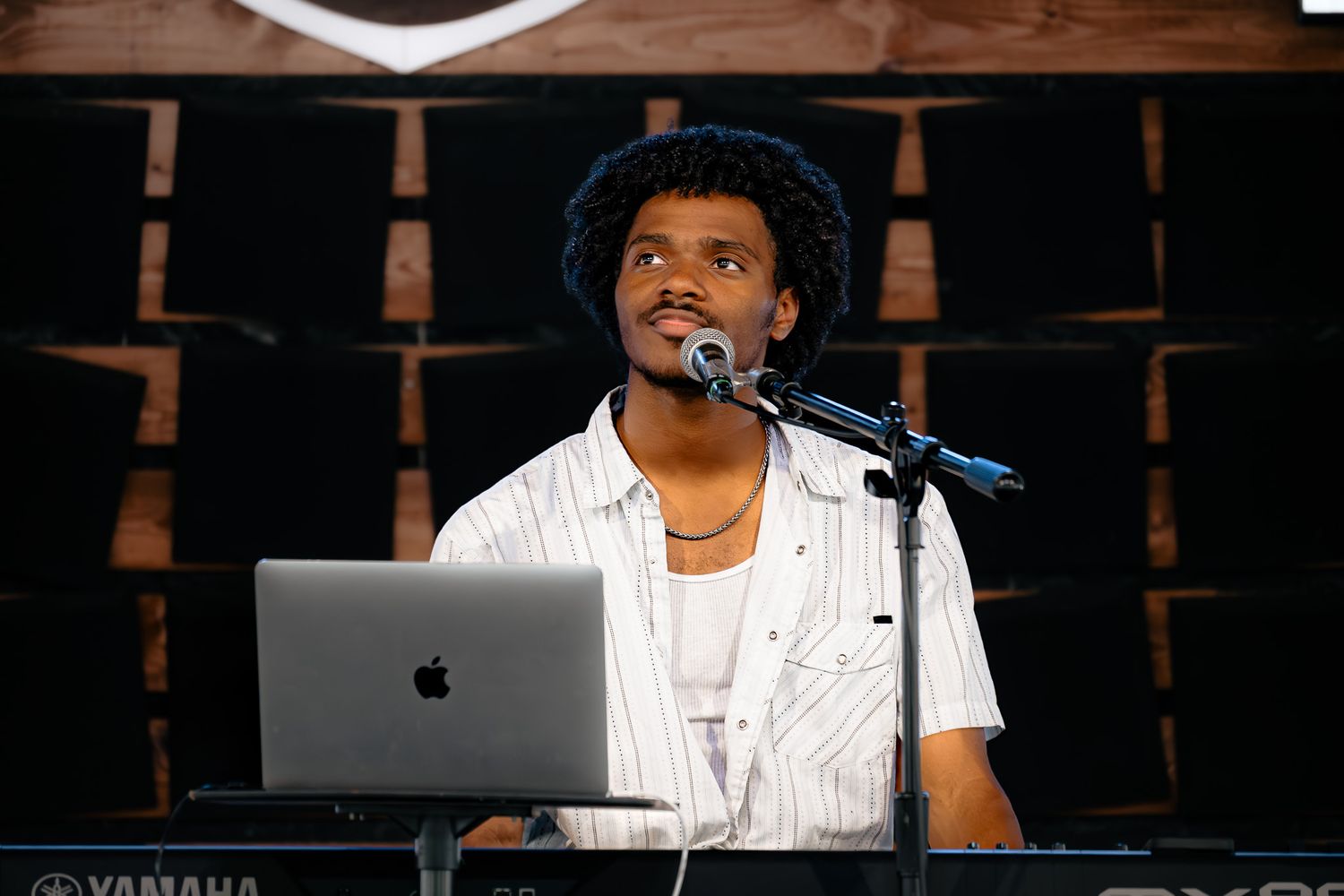 Young black artist Jerard Mosely II performs at True Vine Brewery. Candid shot