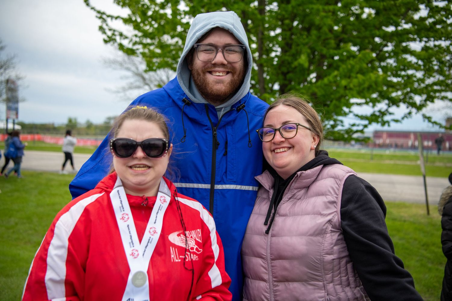 Athletes and supporters sharing celebratory moments at Special Olympics gathering.