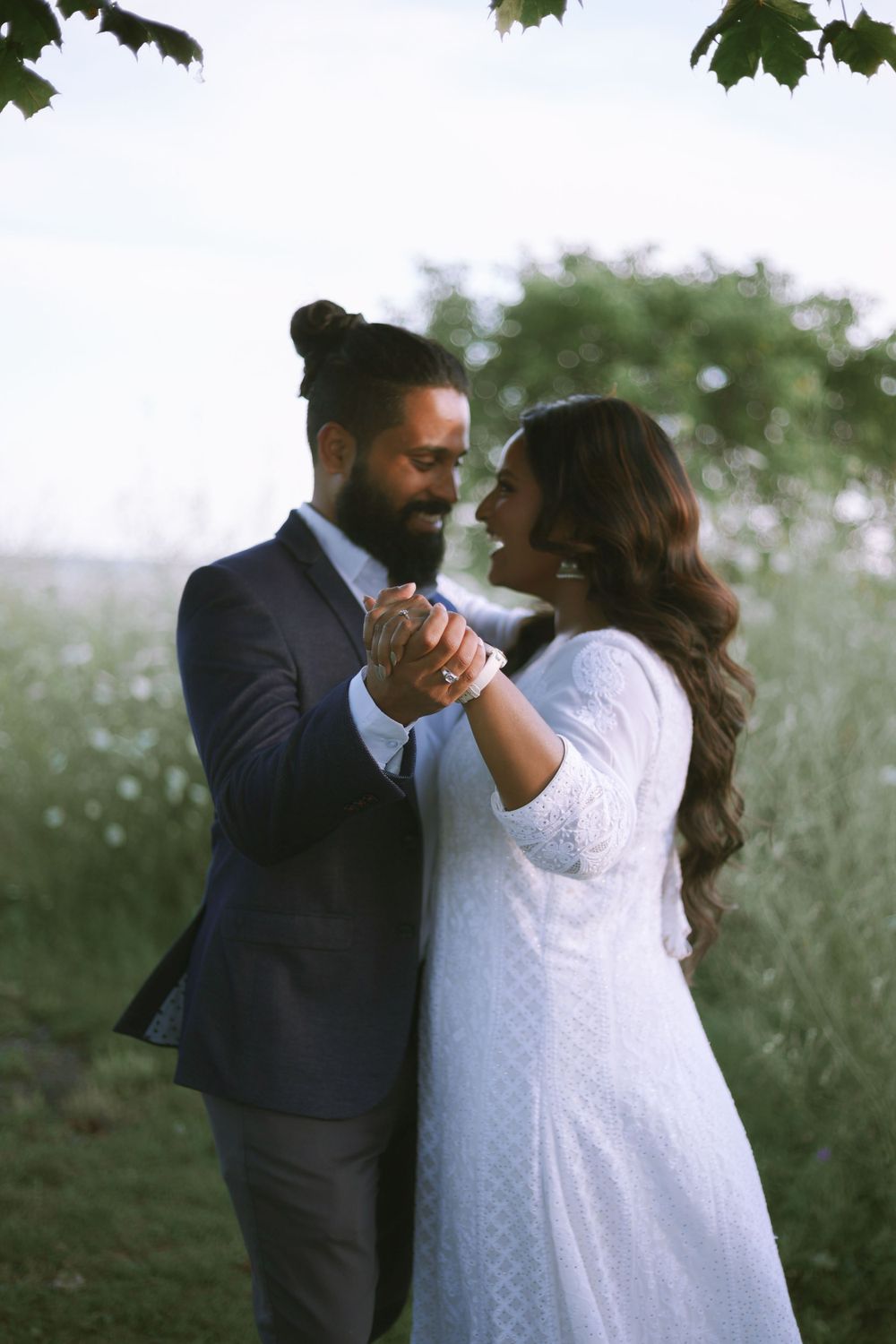 Romantic couple sharing a heartfelt moment in a beautiful outdoor setting.