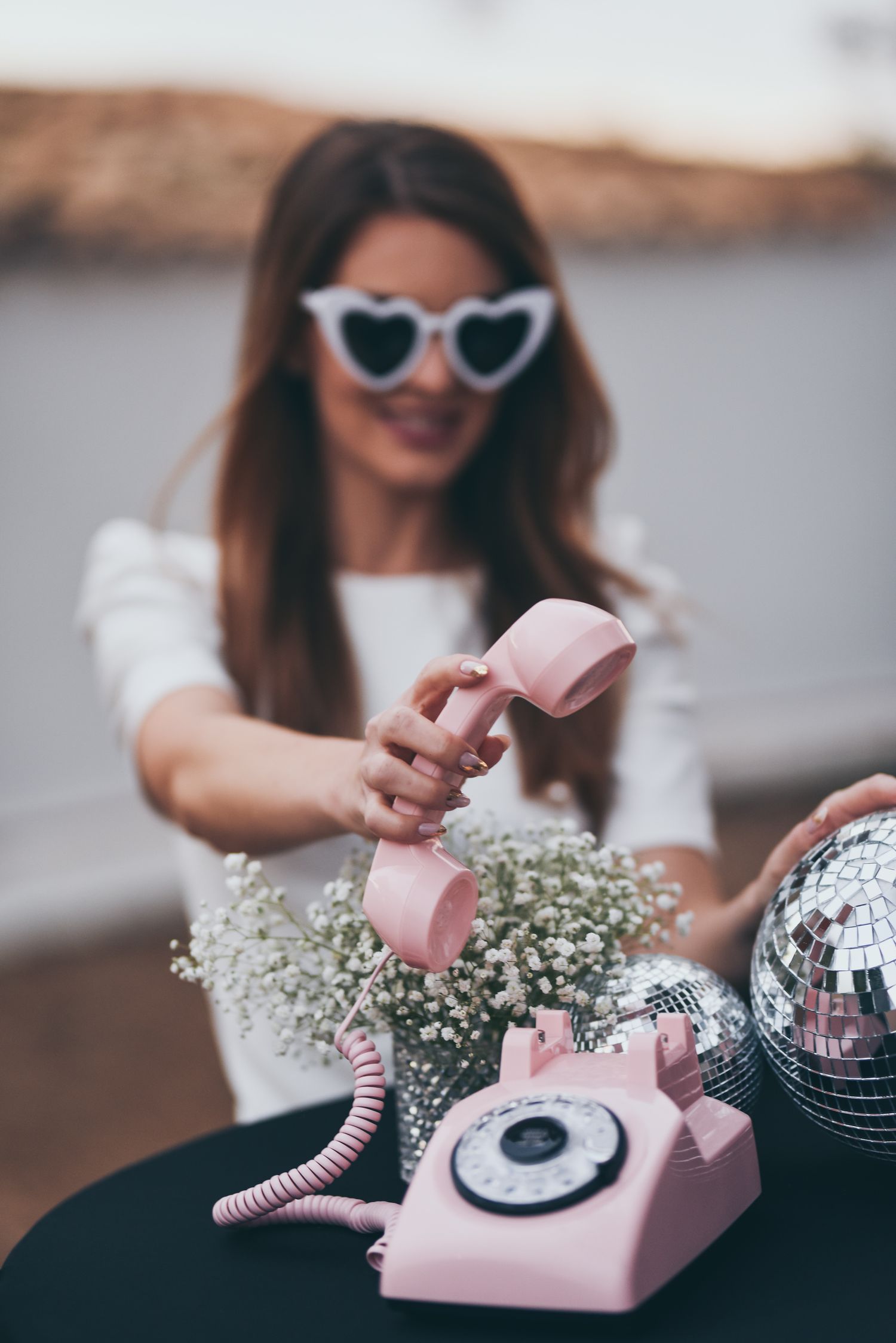 Girl holding a pink retro audio guest book