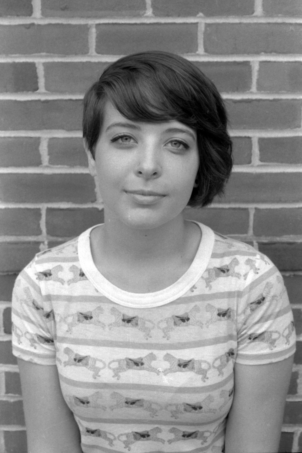 young woman looks at camera