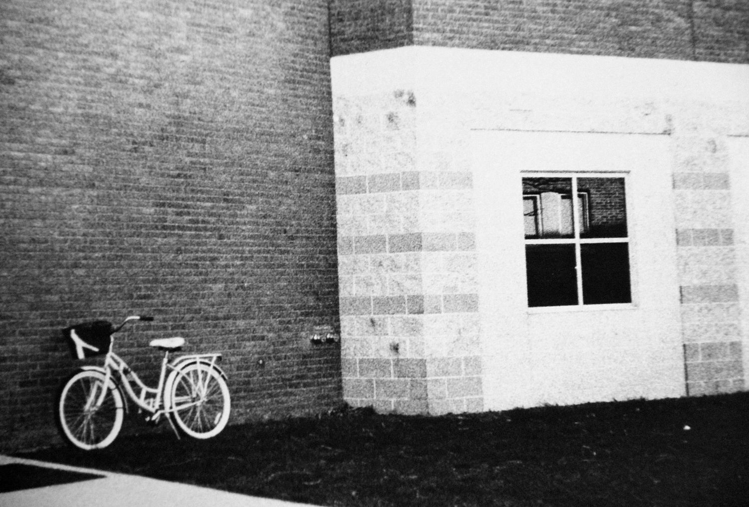bike leaning against brick building