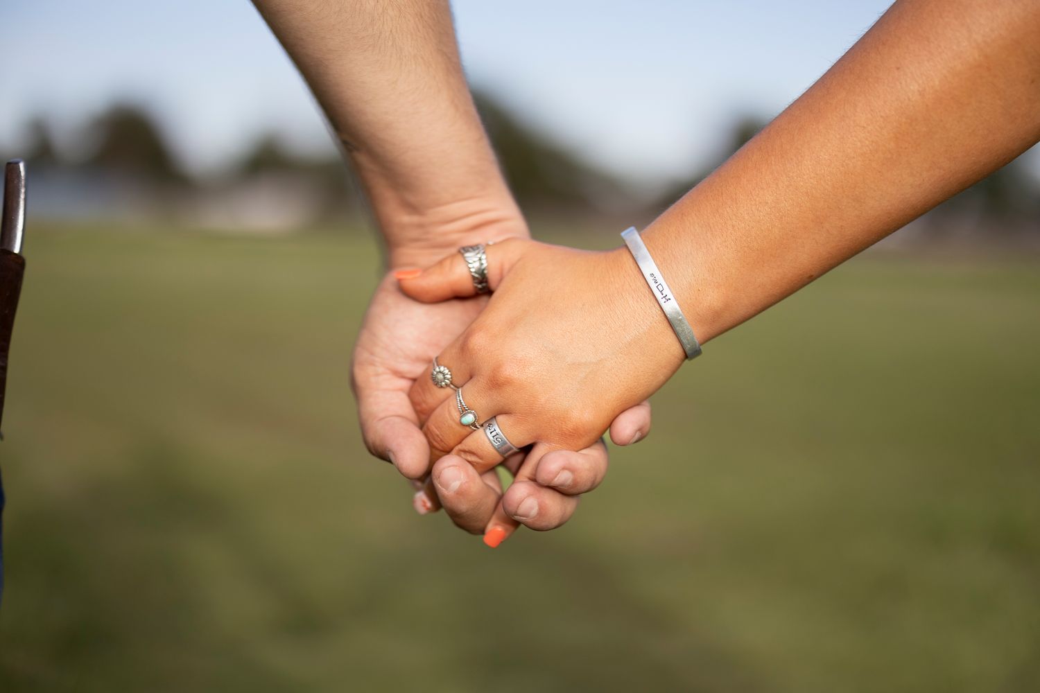 Series of close-up shots showing hands clasped together in unity.