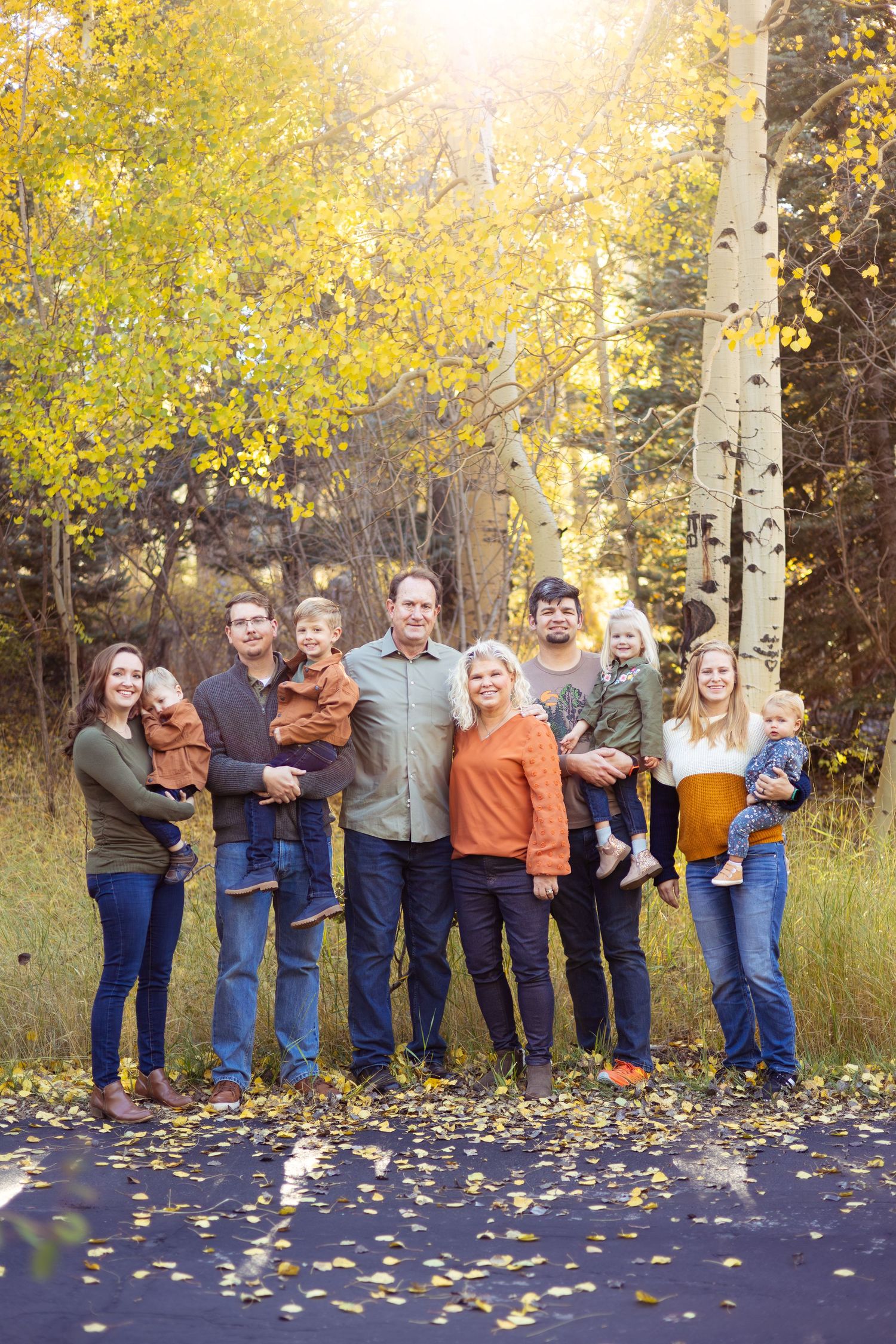 Family portrait with a natural outdoor landscape in the fall season