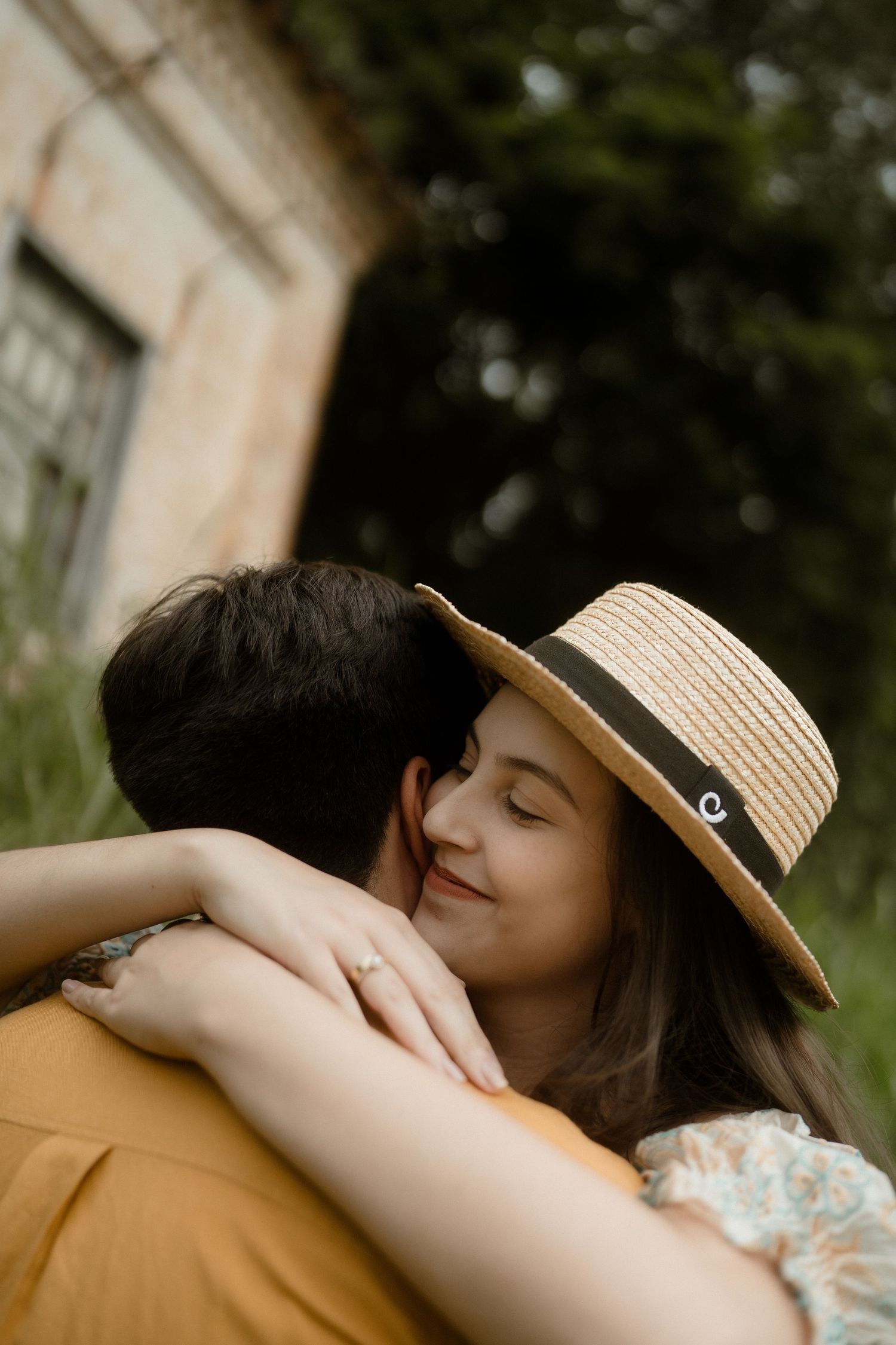Intimate close-up shots of an embracing couple in vintage attire.