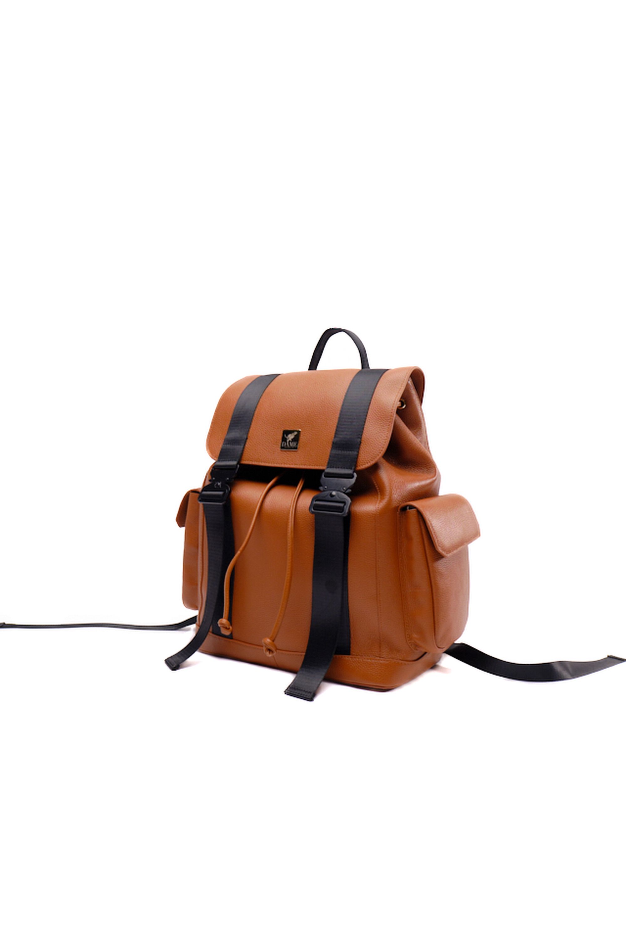 Tan leather backpack with black straps and buckle closures isolated on white background.