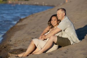 Portrait of couple on a sandy beach.
