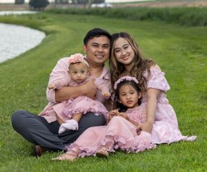 Portrait of family in front of lake.