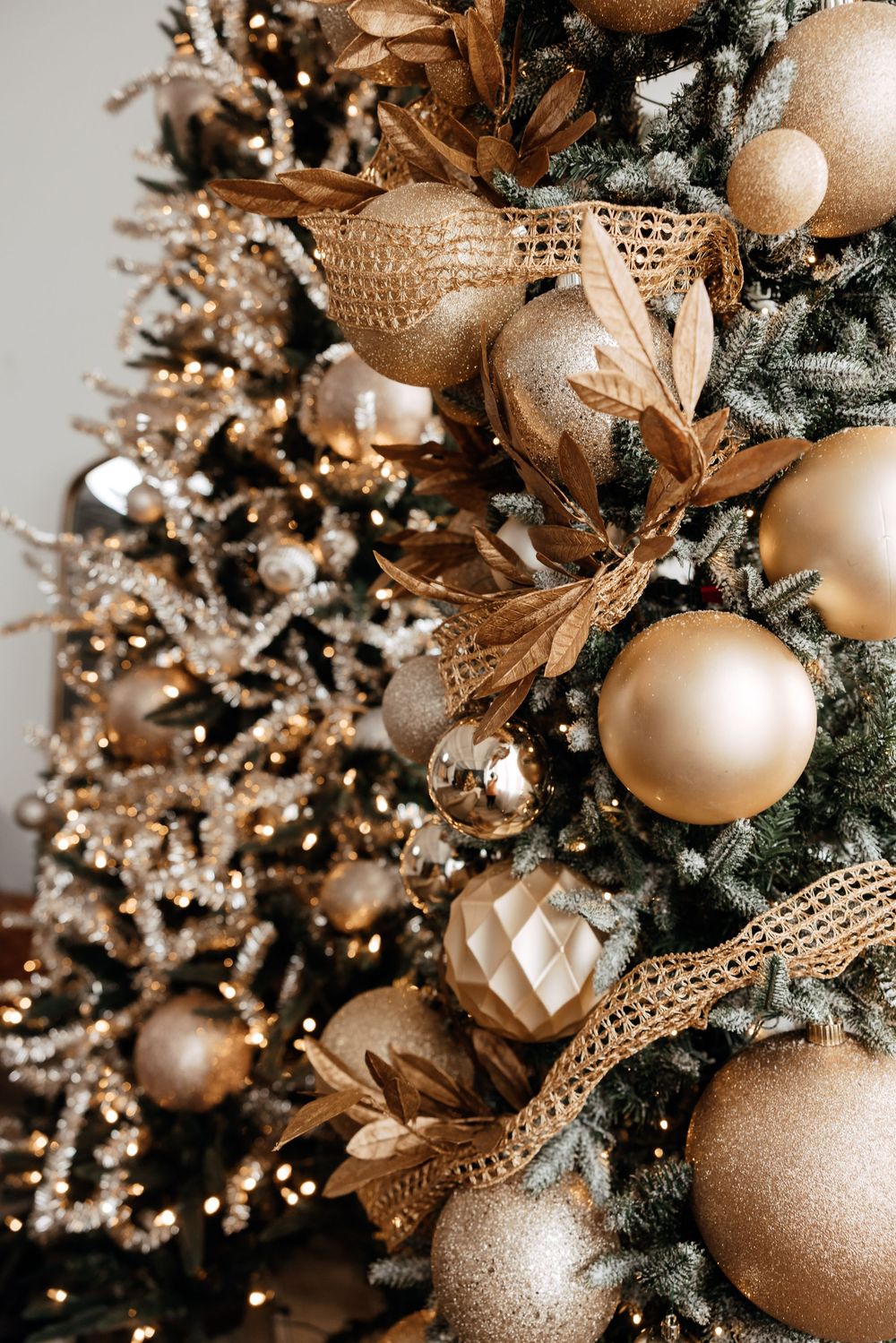 Close-up views of a Christmas tree decorated with gold and champagne colored ornaments and ribbons.