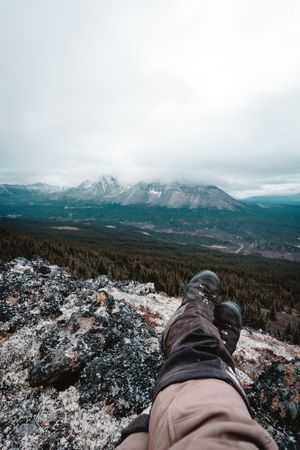 Scenic mountain views captured from a high vantage point showing snow-covered peaks and forested valleys.