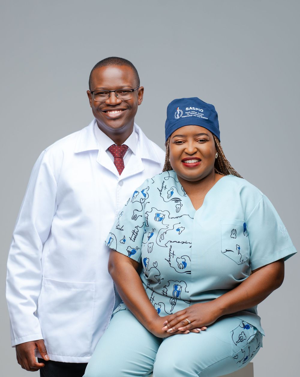 Healthcare workers in white coats and scrubs pose together in a series of professional medical portraits.