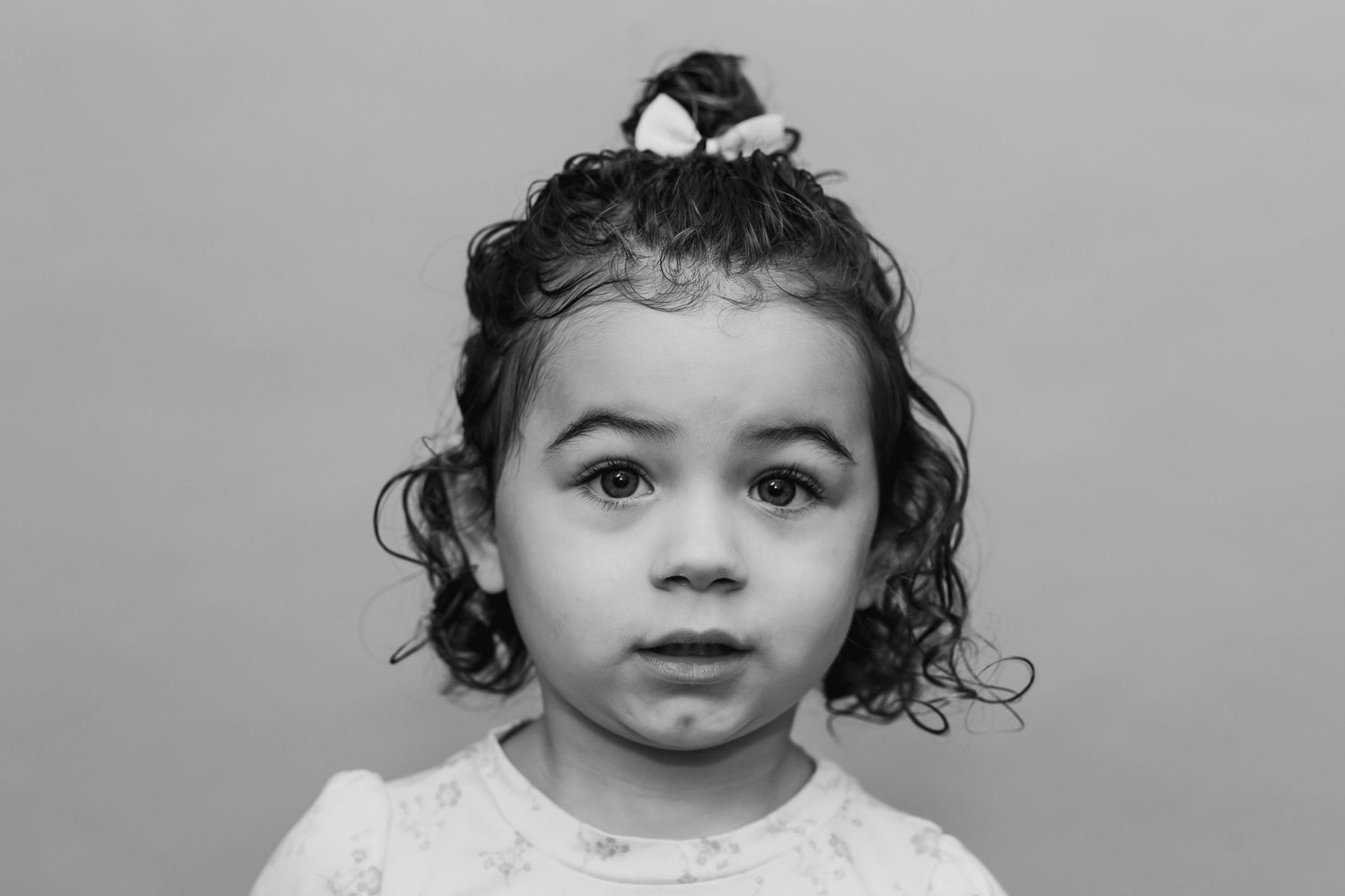 everett school photographer: a black and white portrait of a preschool girl at a school photography session