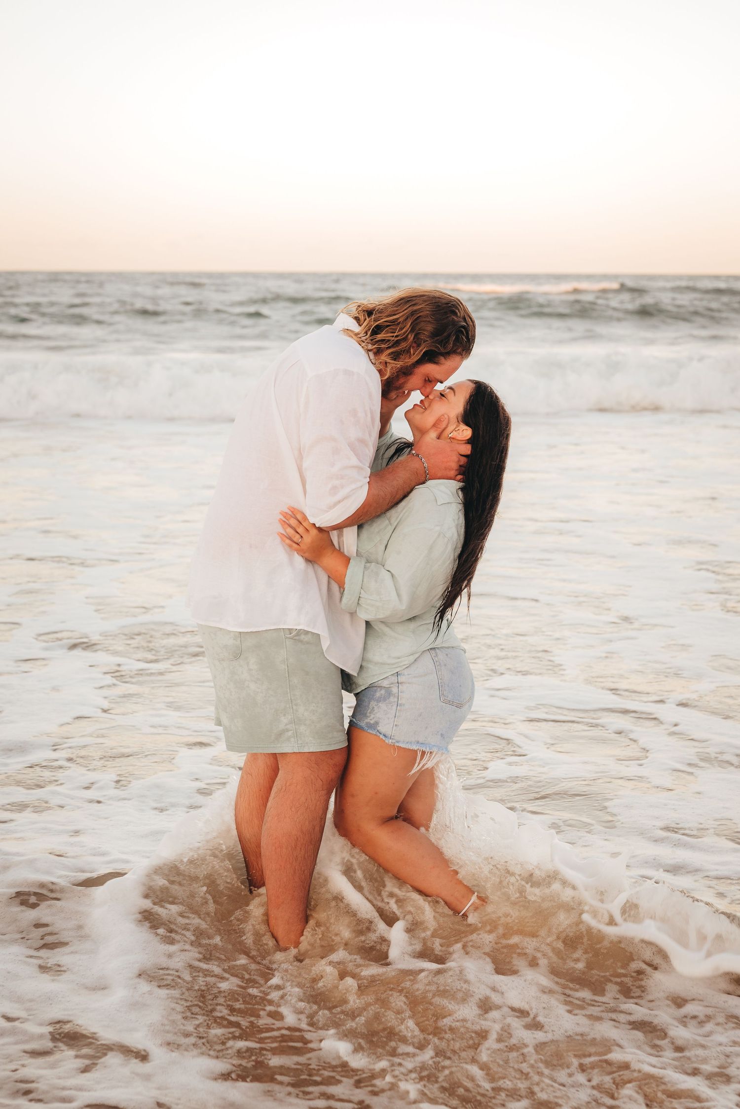 A beautiful moment captured during a couples beach session at Rainbow Beach, Queensland with Nicole Bailey Photography