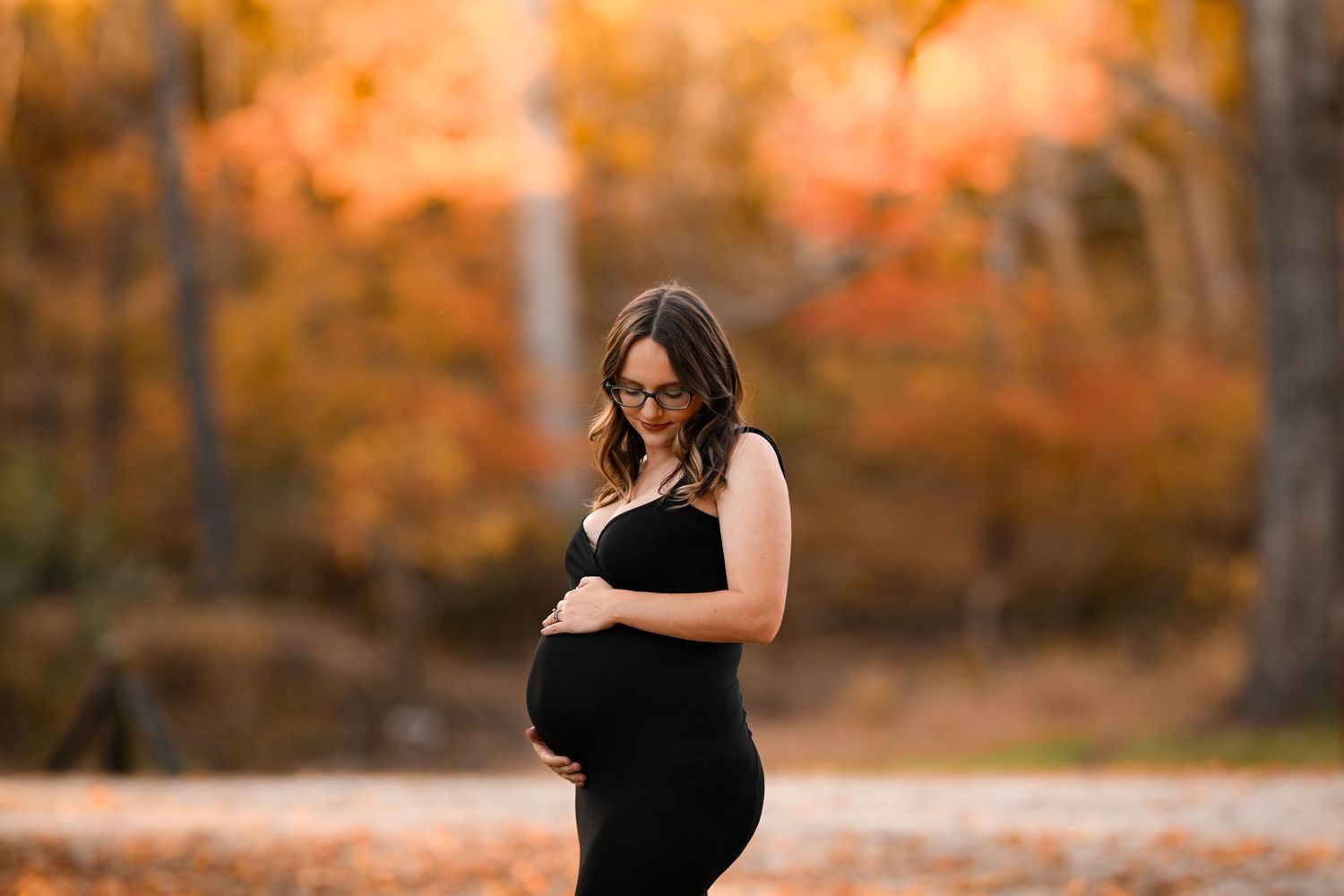 Series of maternity photos captured during golden hour in a fall setting with orange foliage.