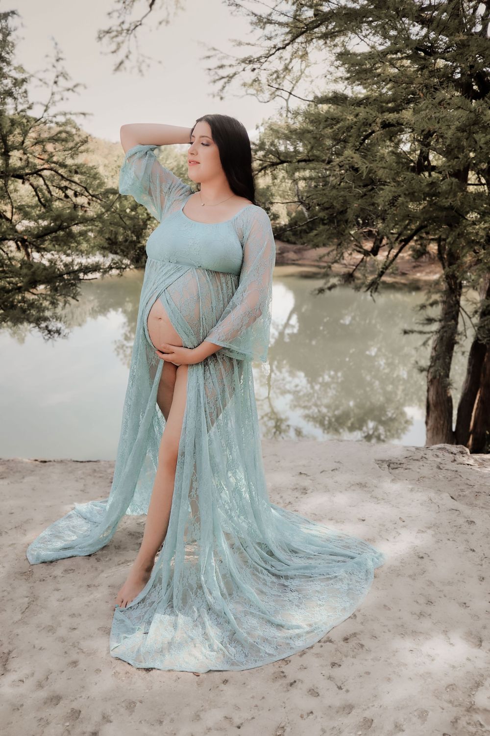 Maternity photo series showing a flowing turquoise gown against a dreamy beach landscape.