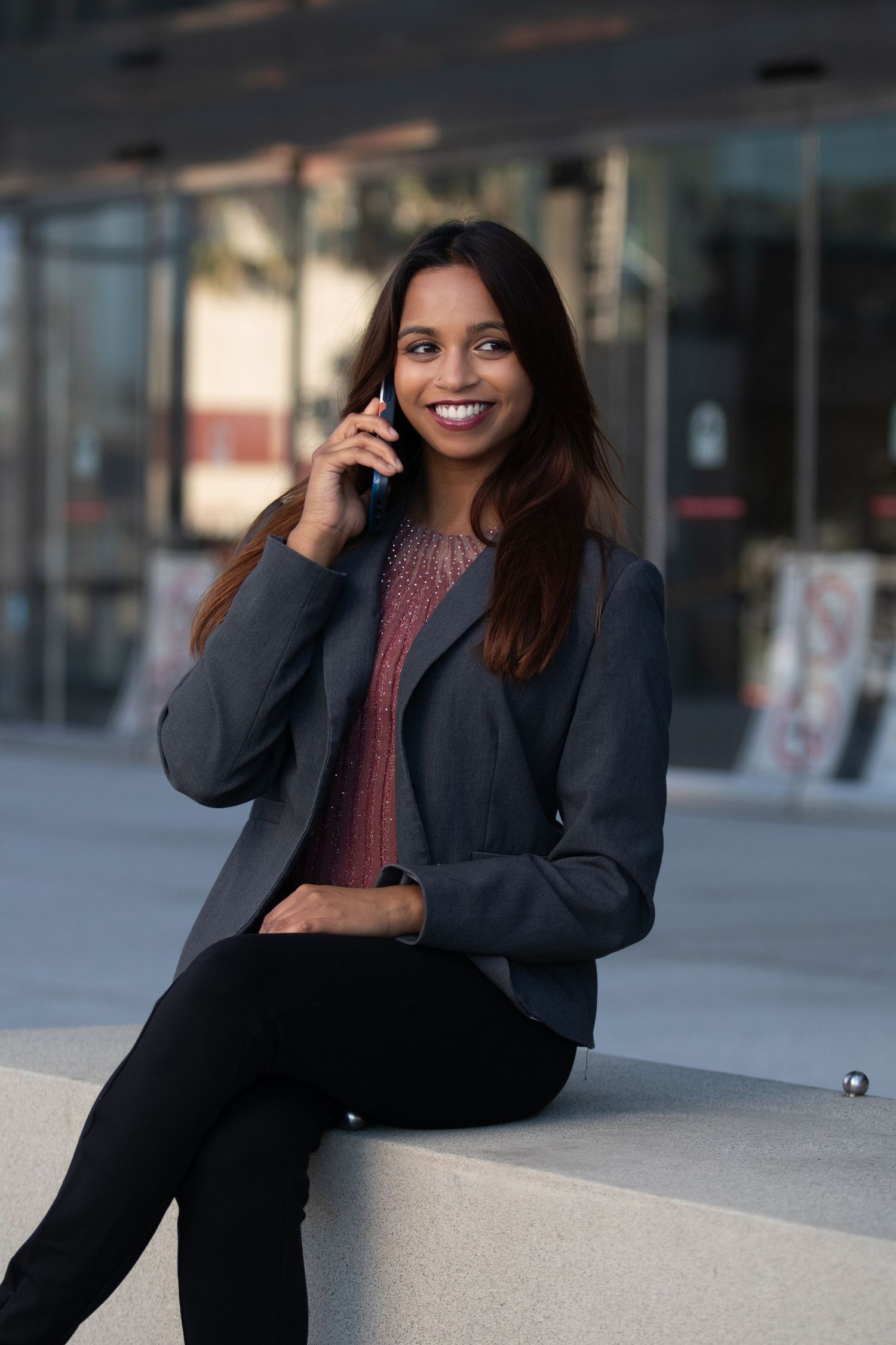 Personal branding photoshoot in Long Beach showing female entrepreneur in professional office setting by Justicee Photography