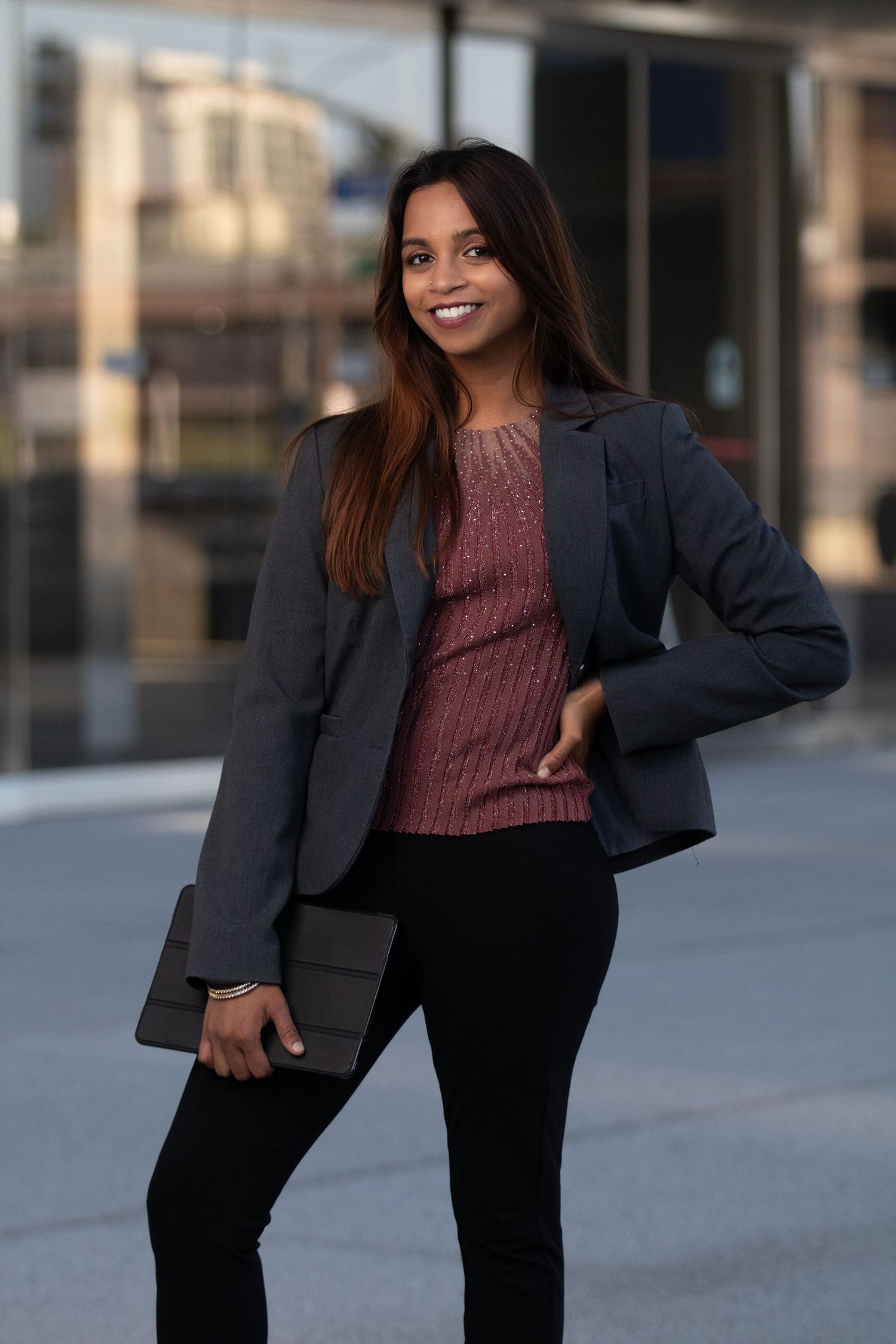 Personal branding photoshoot in Long Beach showing female entrepreneur in professional office setting by Justicee Photography