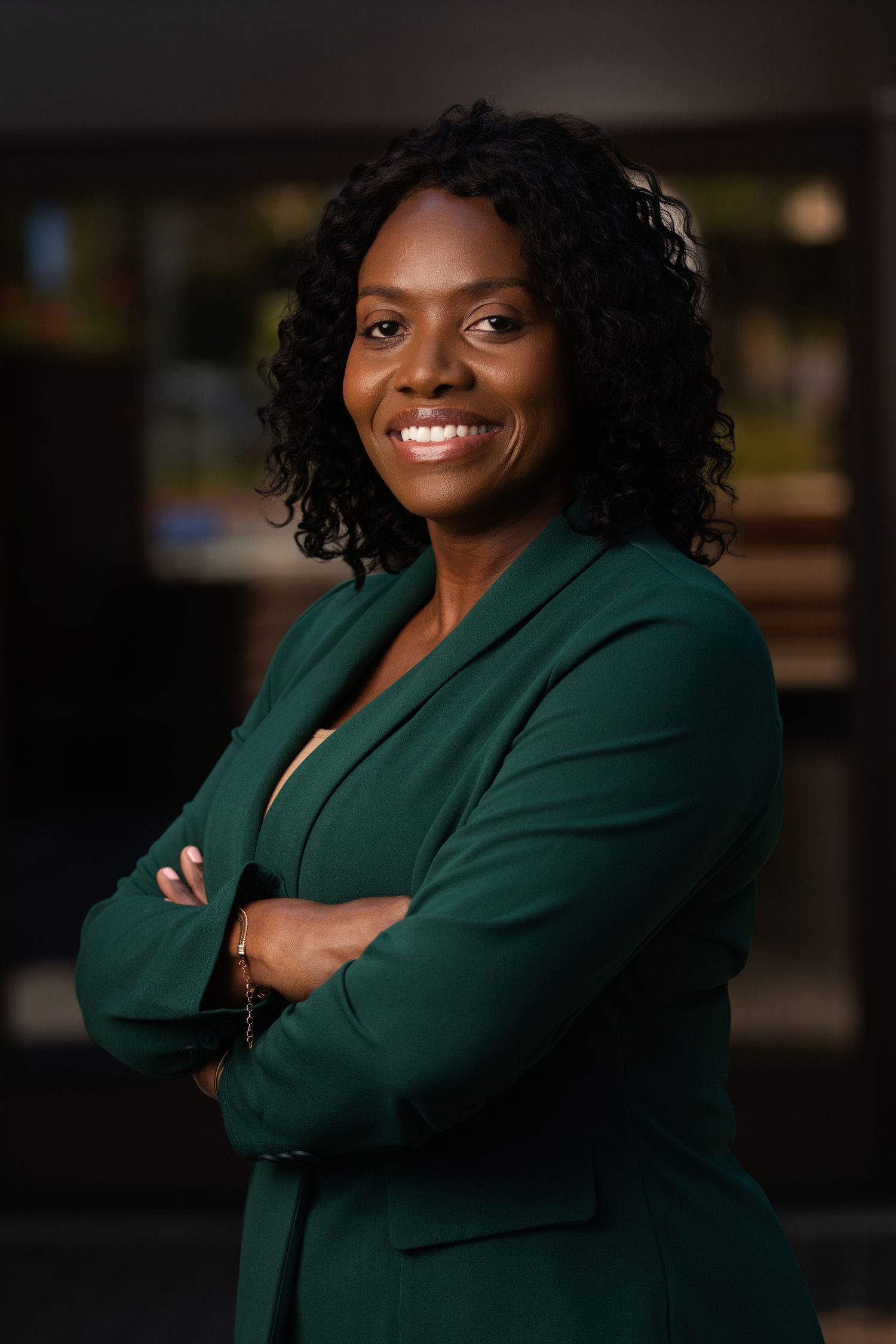 Personal branding photoshoot in Long Beach showing female entrepreneur in professional office setting by Justicee Photography
